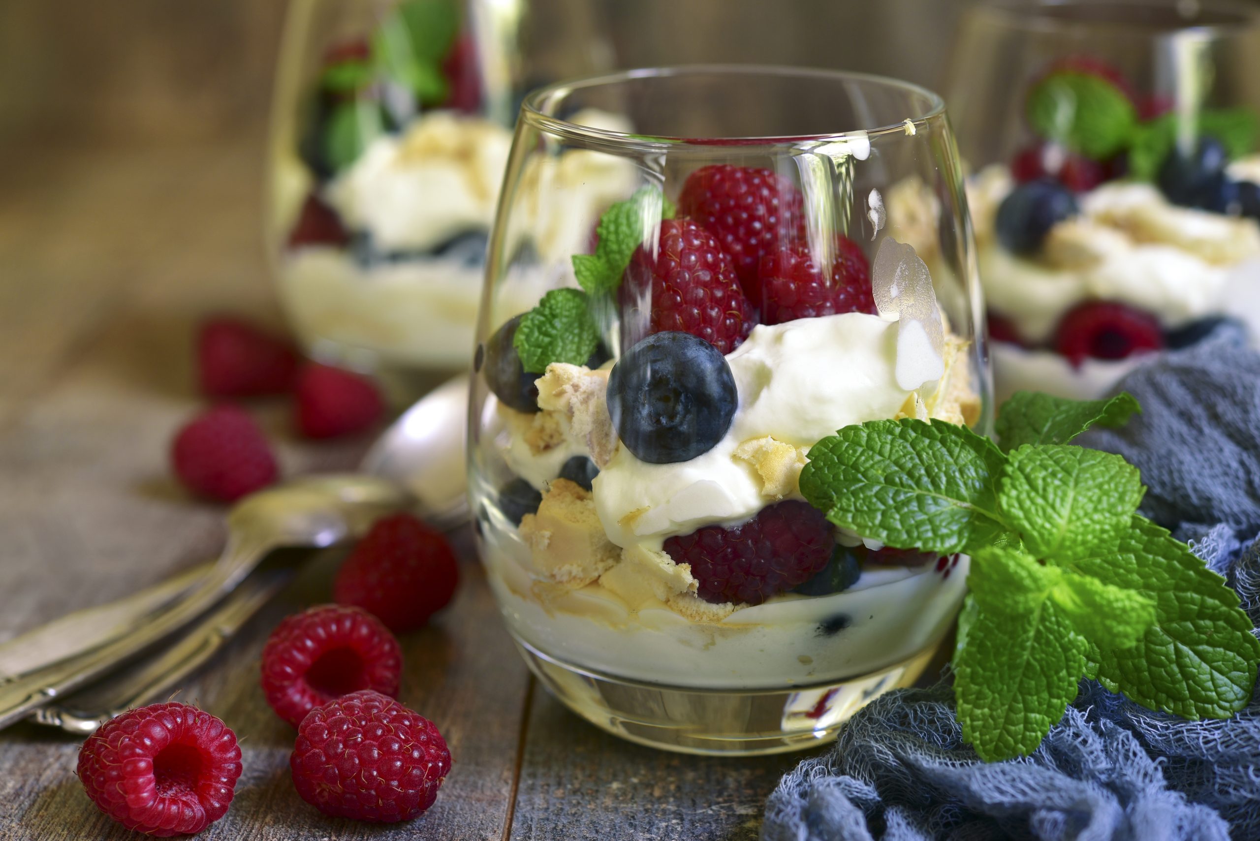 Red, White, and Blue Trifle: Trifle served in glasses isn’t a new idea; it’s been popular in England for decades. This light, satisfying dessert is made by layering almond shortbread pieces, lemon curd cream (lemon curd swirled into whipped cream), whipped cream flavored with limoncello (lemon liqueur), fresh raspberries, blueberries, and mint leaves for decoration.
