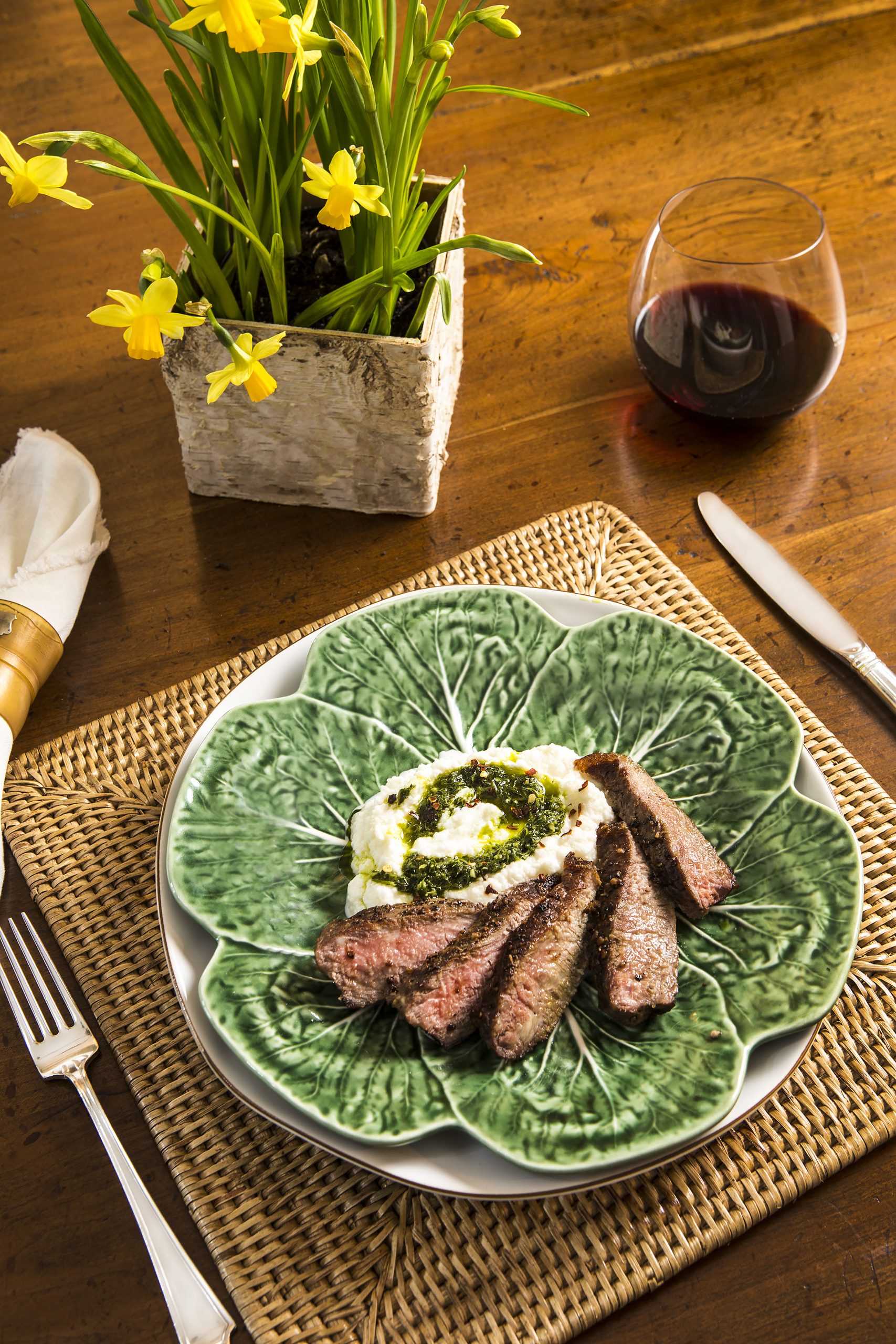 Tasty steak and mashed cauliflower with chimichurri sauce is a nontraditional, quick and easy combination, which makes a beautiful presentation! 
Bordallo Pinheiro Cabbage Plate from Portugal with Juliska Puro Whitewash Dinner Plate and rattan placemat, courtesy of Cottage & Vine.