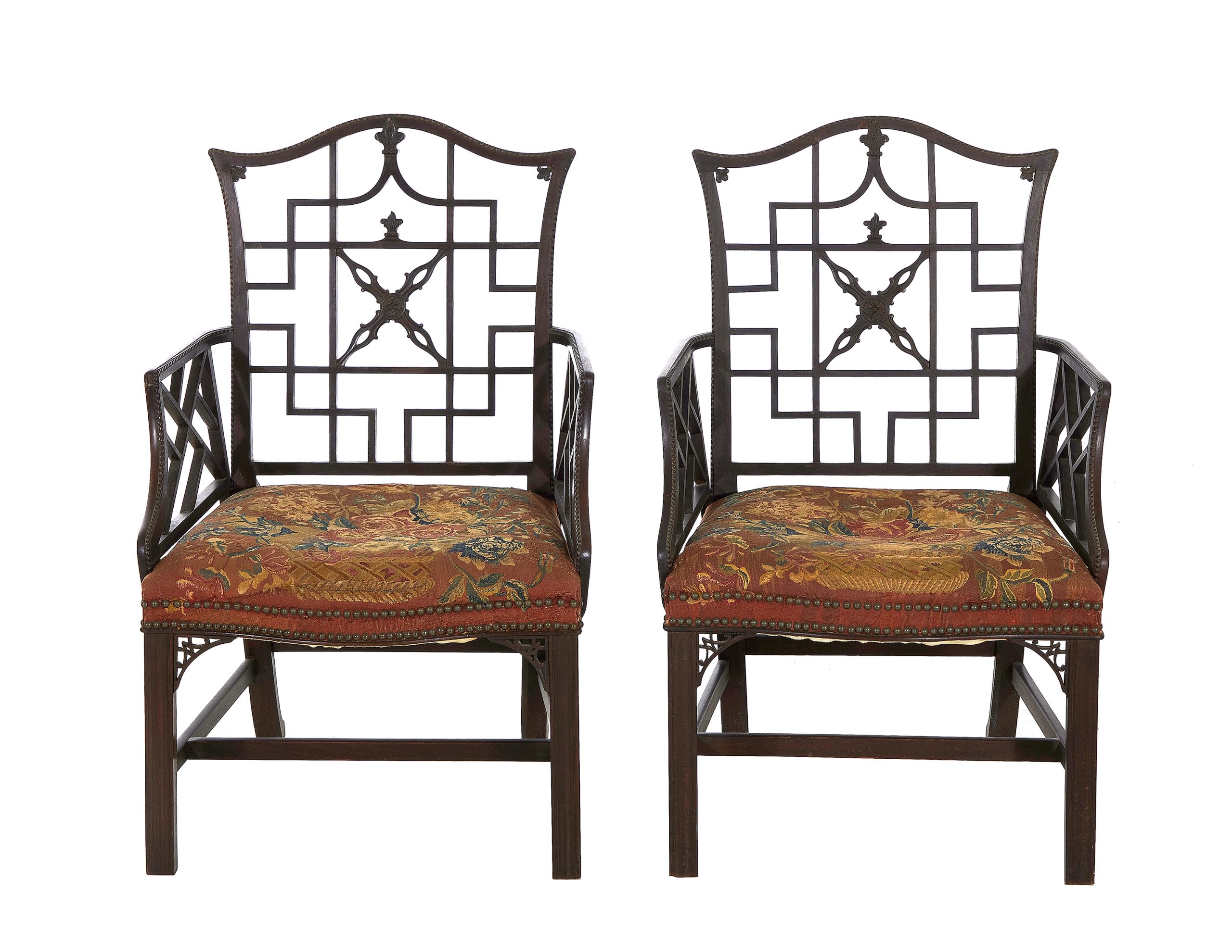 A pair of George II carved mahogany armchairs covered in Soho tapestry, circa 1755. Sold for $125,000 to a South Carolina collector.
