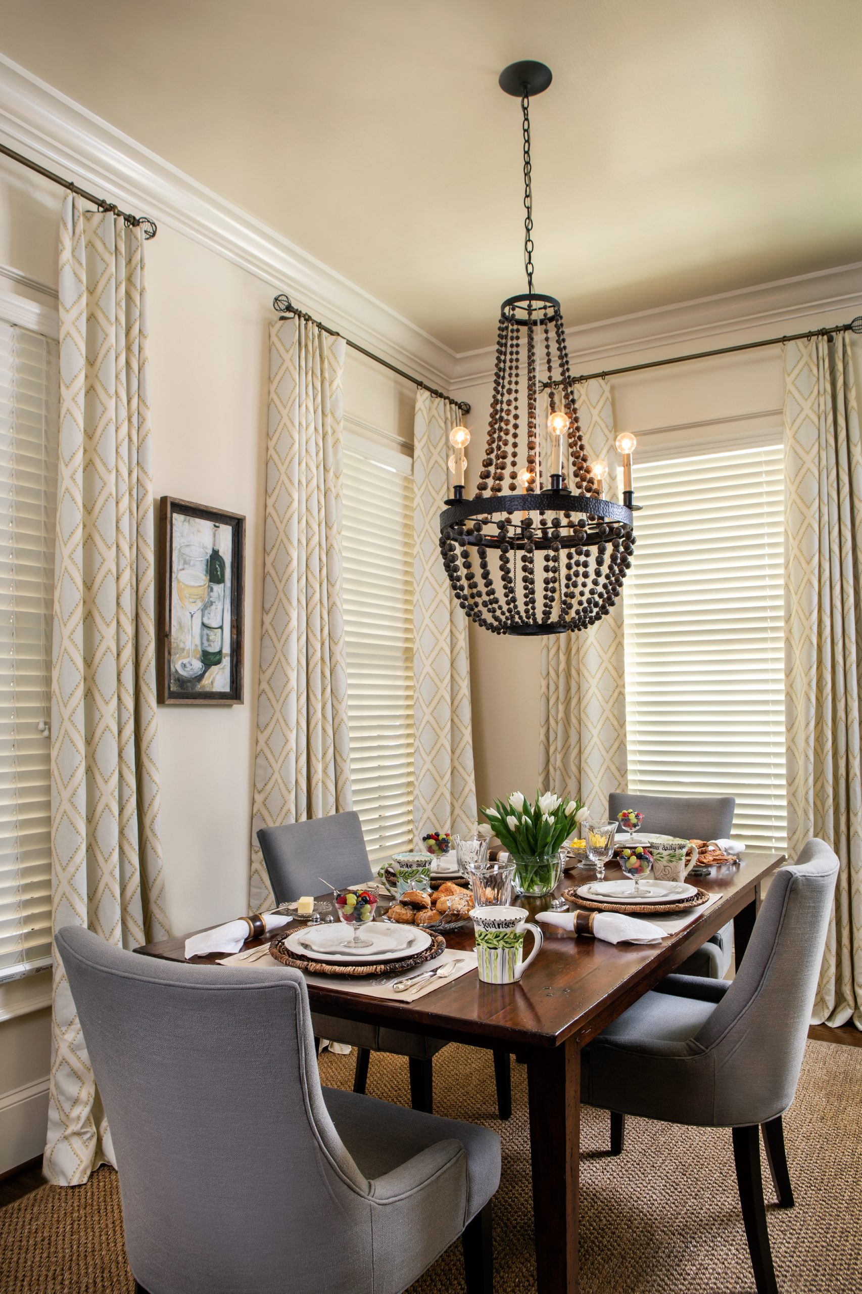 The breakfast room in the corner of the kitchen lit by a dark beaded chandelier is perfect for family meals with sons Matthew and Jordan and now daughter-in-law Amelia.