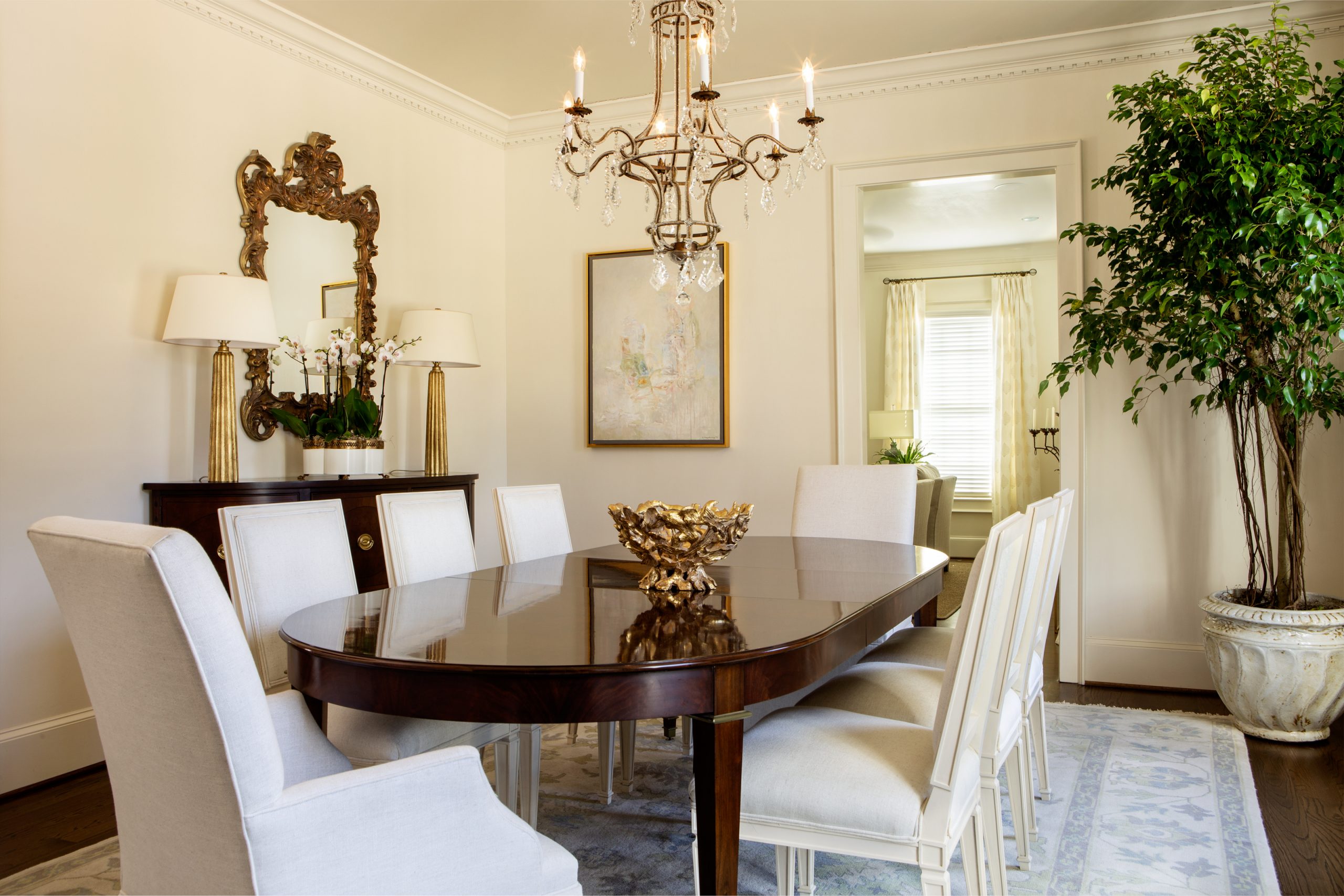 The front formal rooms of the house are framed with dentil molding and more formal pieces of art. Lisa credits her good friend Eveleigh Hughey with Brandon Davidson Interiors for the home’s beautiful decor. 