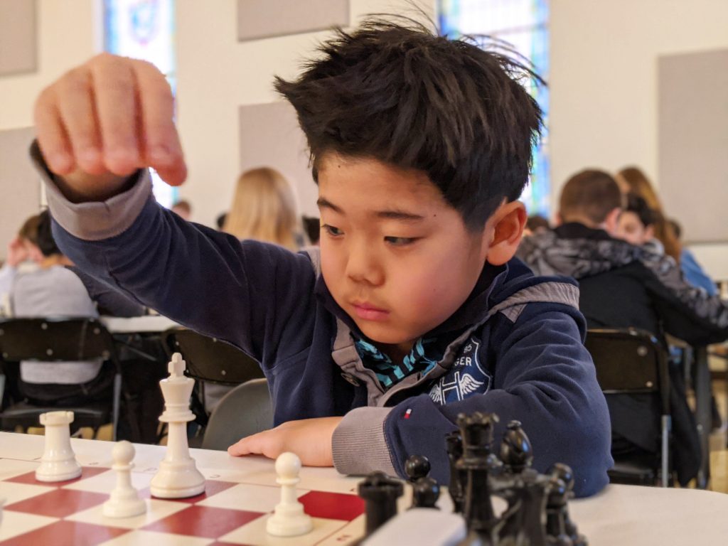 Like languages, a person is better able to absorb chess when young. Robert Shim plays in the Midlands Scholastic Chess League. 