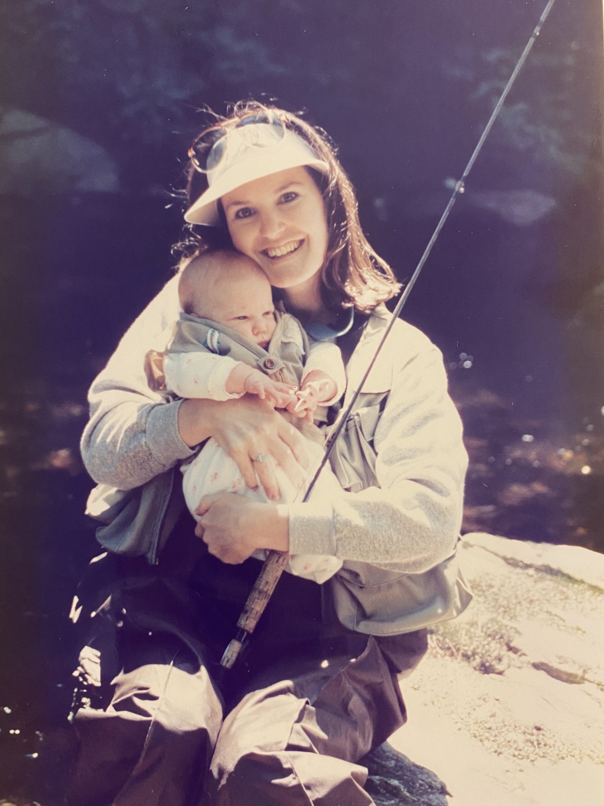 Margaret at 2 months old, fly fishing with her mom, Emily.