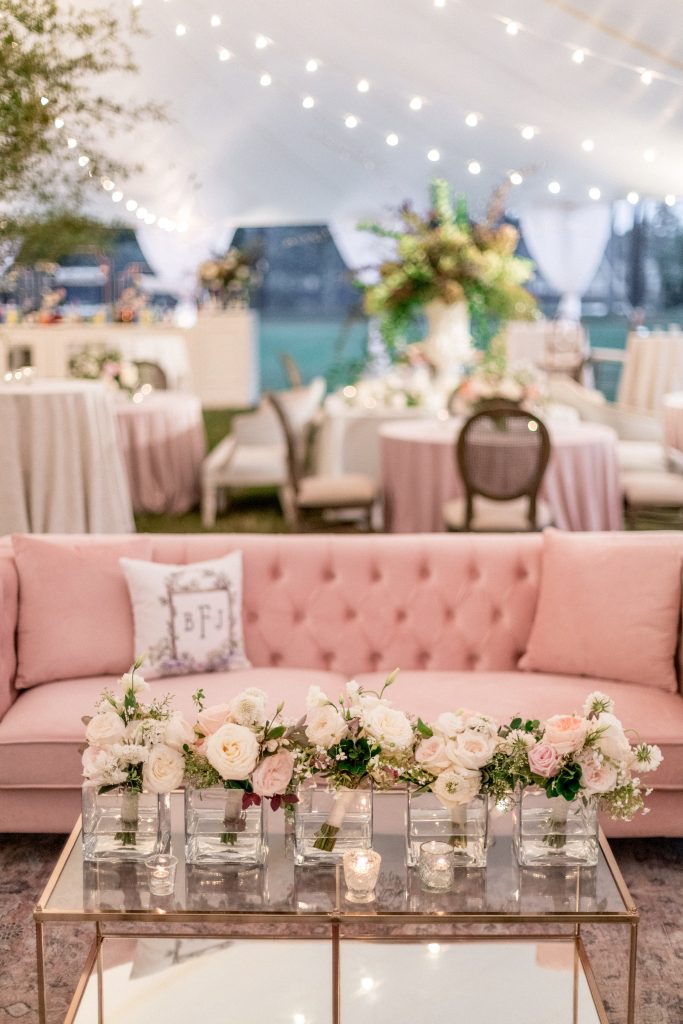 Event planner Meagan Warren created multiple exquisite vignettes where family and friends could gather throughout the tented reception. Ambient Media made sure the lighting was magical.