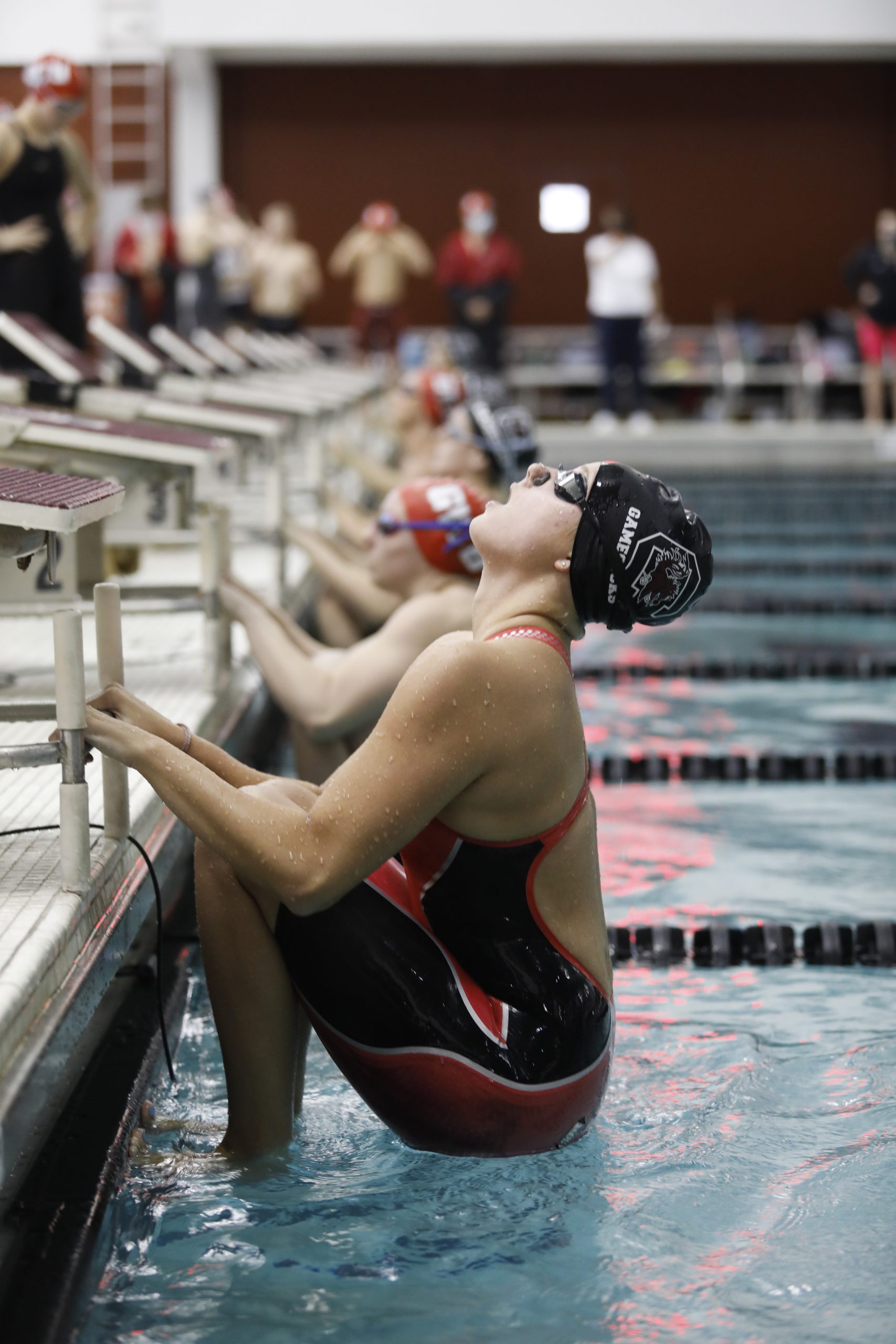 USC swimmer Megan Armstrong takes her mark for the 500-meter backstroke in a swim meet against Gardner-Webb University. Photography by Kelly Teseny