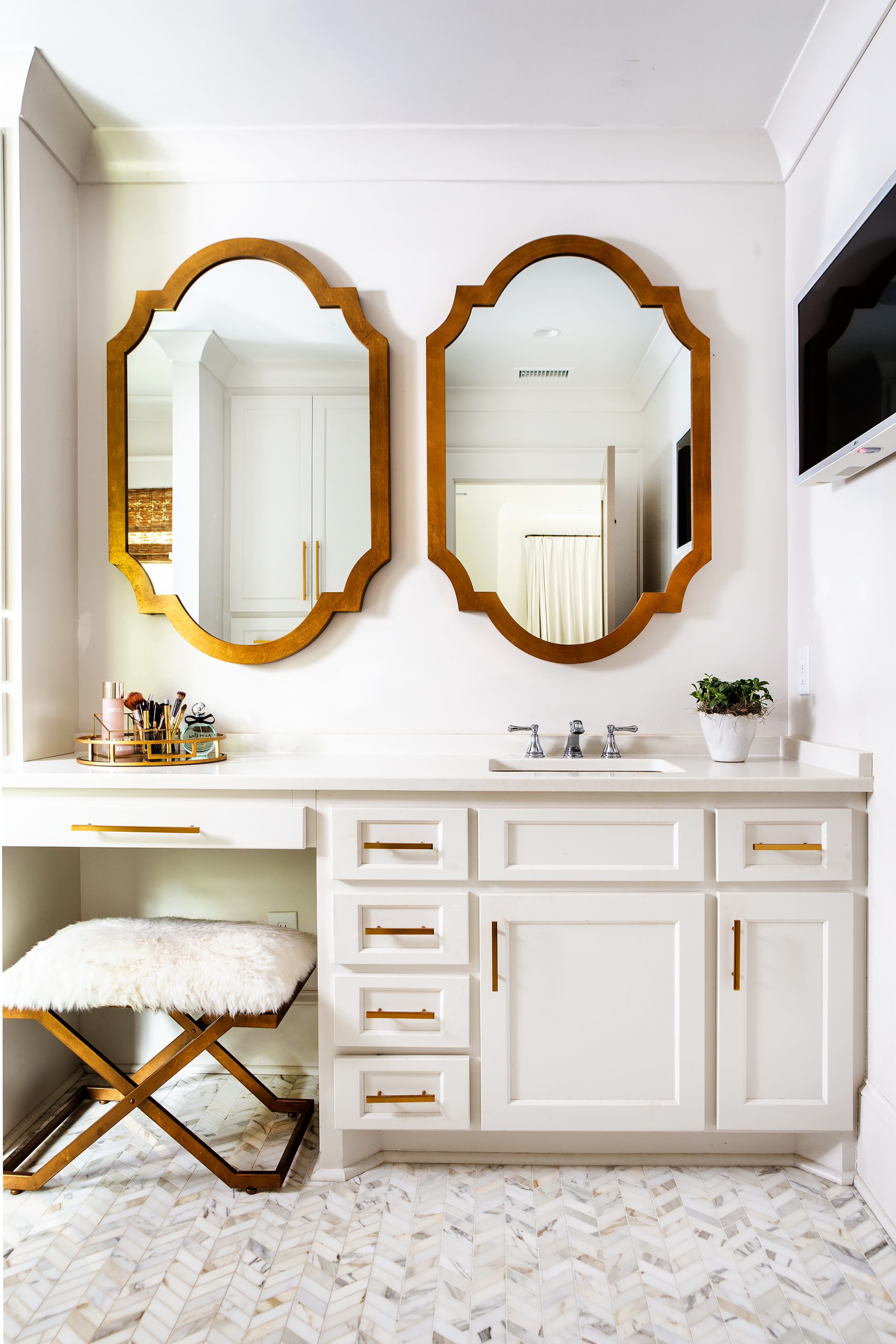 Top left: An addition houses the couple’s spacious new bedroom and his-and-her baths and closets.  Wendi’s bath is glamorous while being functional, with marble from Marble and Granite Creations and floor tile selected by Cathrine Reynolds at Palmetto Tile.