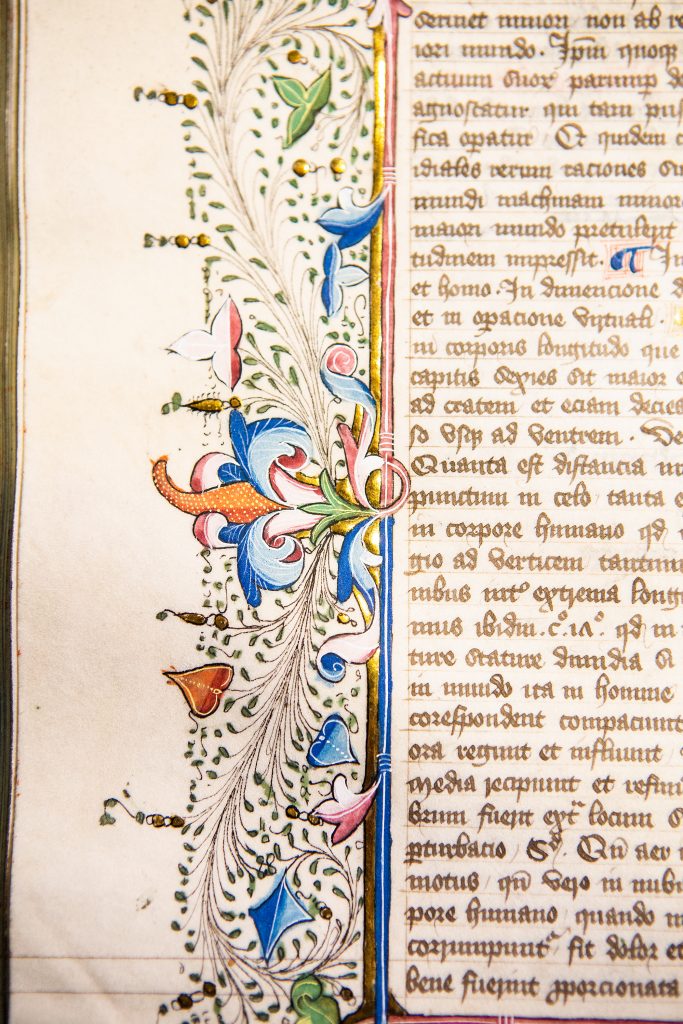 Medieval manuscripts were exactingly copied and richly decorated. This intricate foliate border is characteristic of 15th century English decoration. 