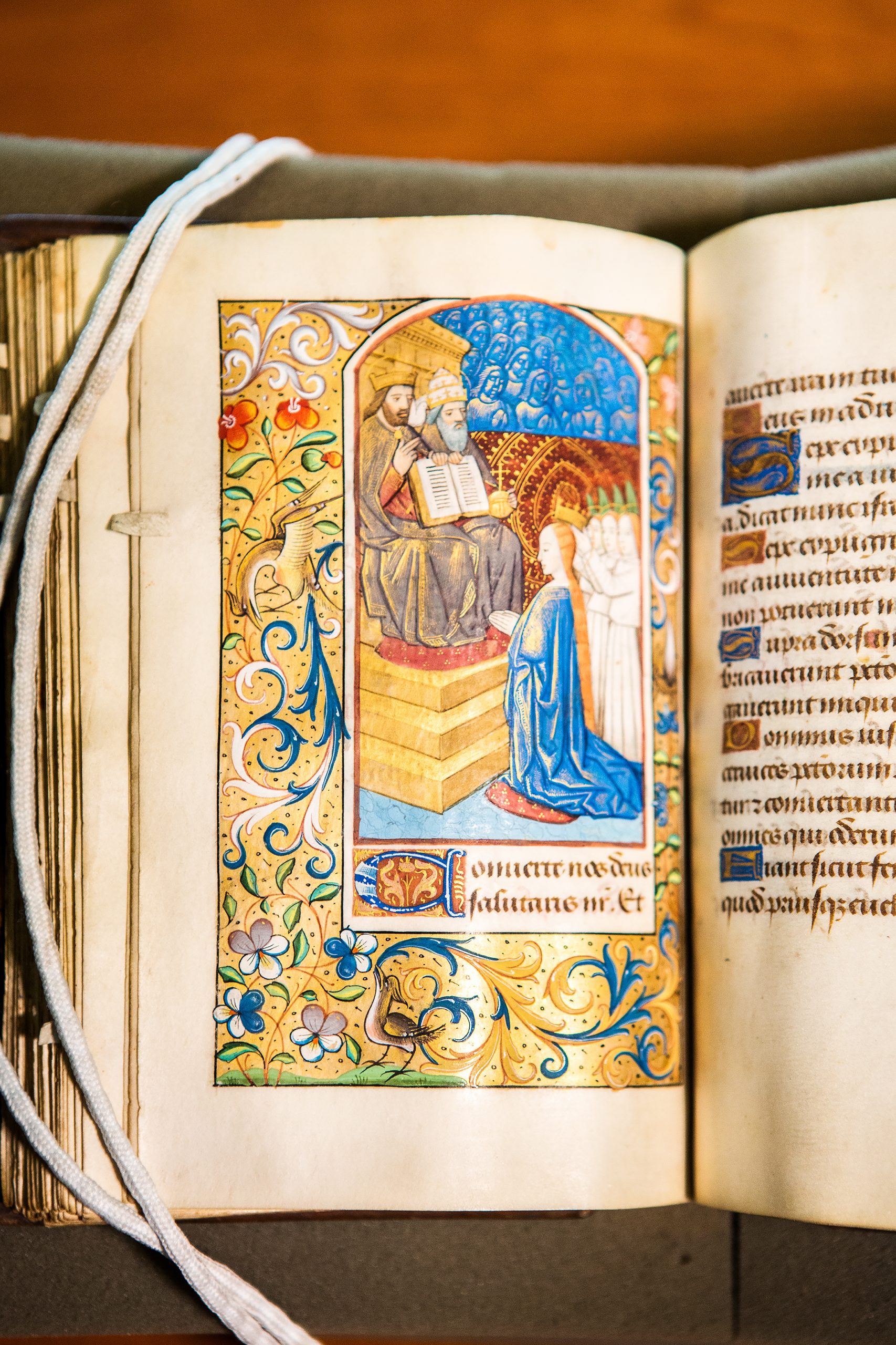 At bedtime, the French owner of this lavish prayer book could admire the Virgin’s coronation in heaven and reflect on the spiritual rewards of motherhood. She kneels before the Trinity: Father, Son, and Holy Ghost, who is depicted as a dove. Bright blue cherubim look on in the background.