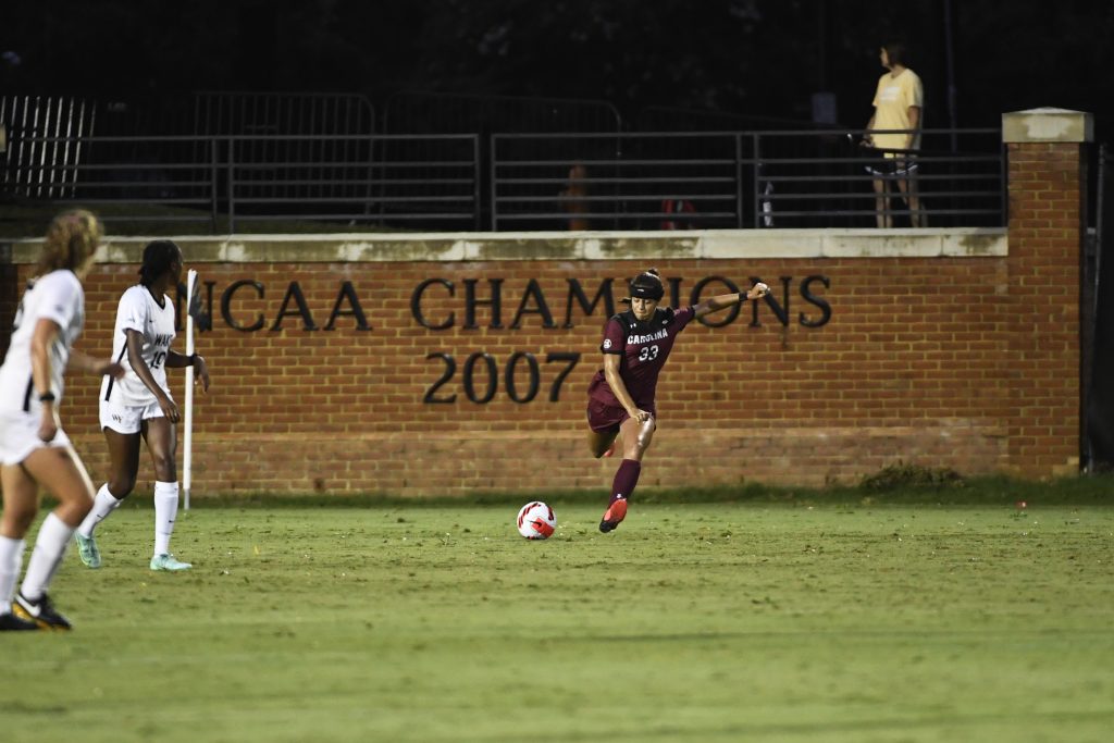 Jyllissa Harris takes a free kick in the defensive zone at Wake Forest.