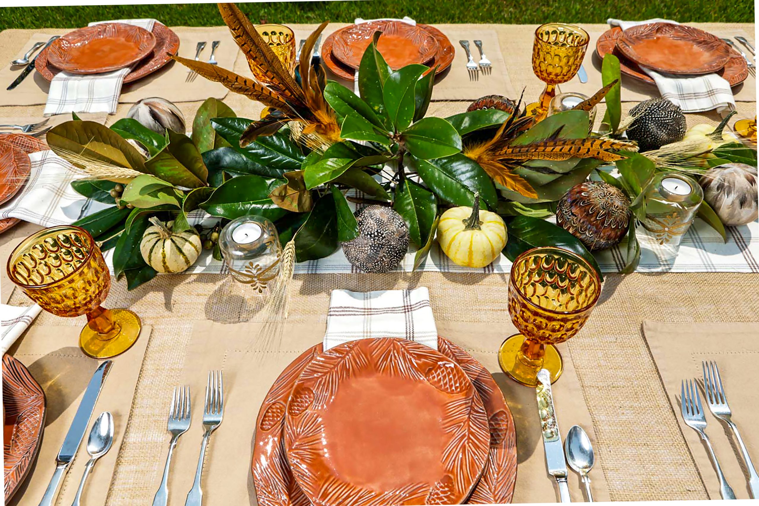  Transform the table above by using magnolia leaves, feathers, and just a few pumpkins for a completely different aesthetic!