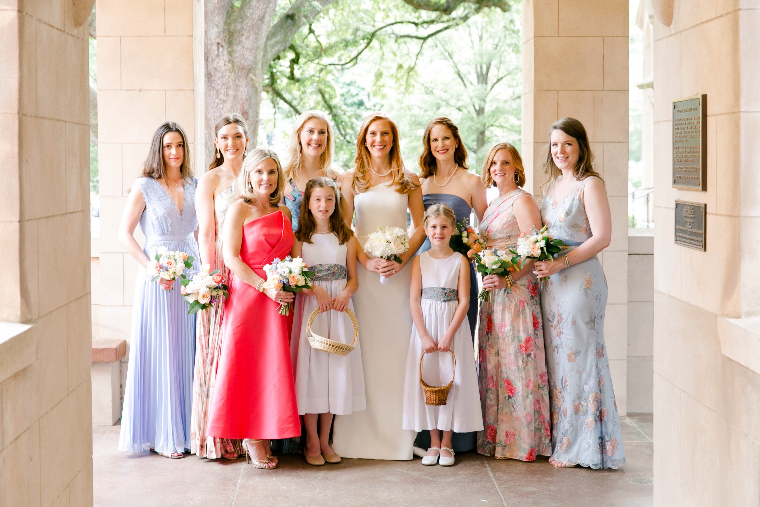 Bride-to-be- Katherine Dyke and her mother and wedding planner, Melanie Crawford, chose a color scheme of coral and French blue for Katherine’s spring 2021 wedding to William Buyck. Katherine wanted each of her attendants to wear different dresses and feel comfortable. Some dresses were floral, others were solid, and all were different styles. Bridesmaids Allison Courtin, Solveig Entwistle, Adele Grimsley, Mary Caroline Bubnovich, bride Katherine Buyck, Margaret Clay, Trenholm Hardison, and Stephanie Anklin. Flower girls Liddy Grimsley and Perry Dyke. 