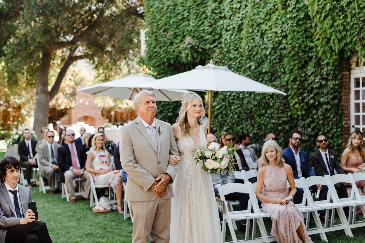 Ashton was escorted down the aisle by her stepfather, Jim Bonniville.
