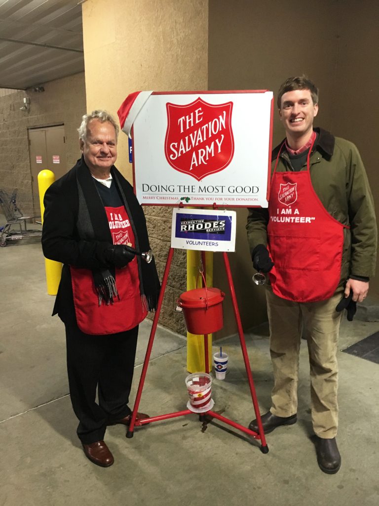Thomas rings the bell for The Salvation Army with his father, Dusty Rhodes.