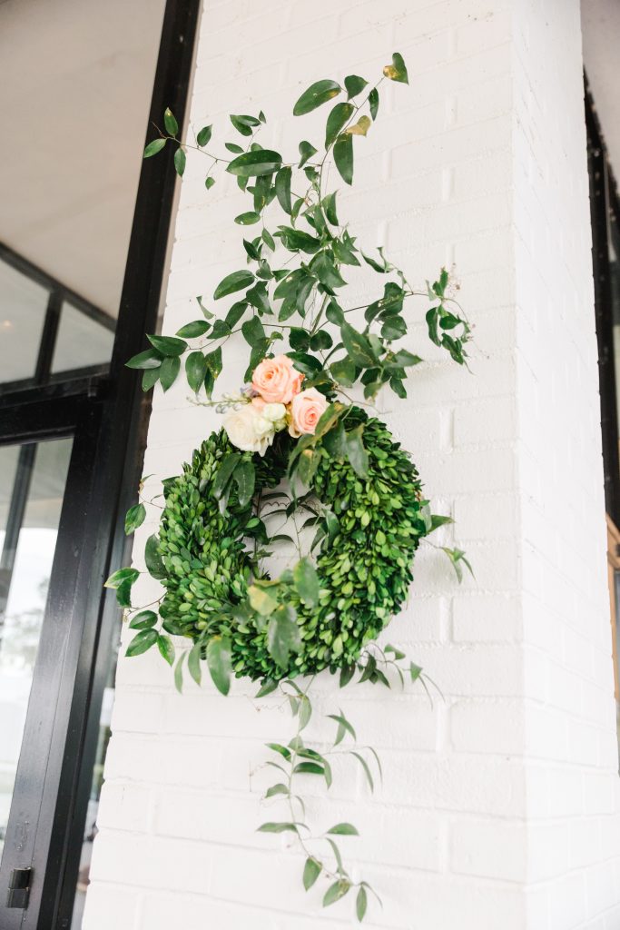  The wedding couple wanted to use greenery representing their families.  Smilax came from the Buyck family farm  and lily of the valley, greenery, and boxwoods were from Mary Walker’s Shelby, North Carolina, garden. 