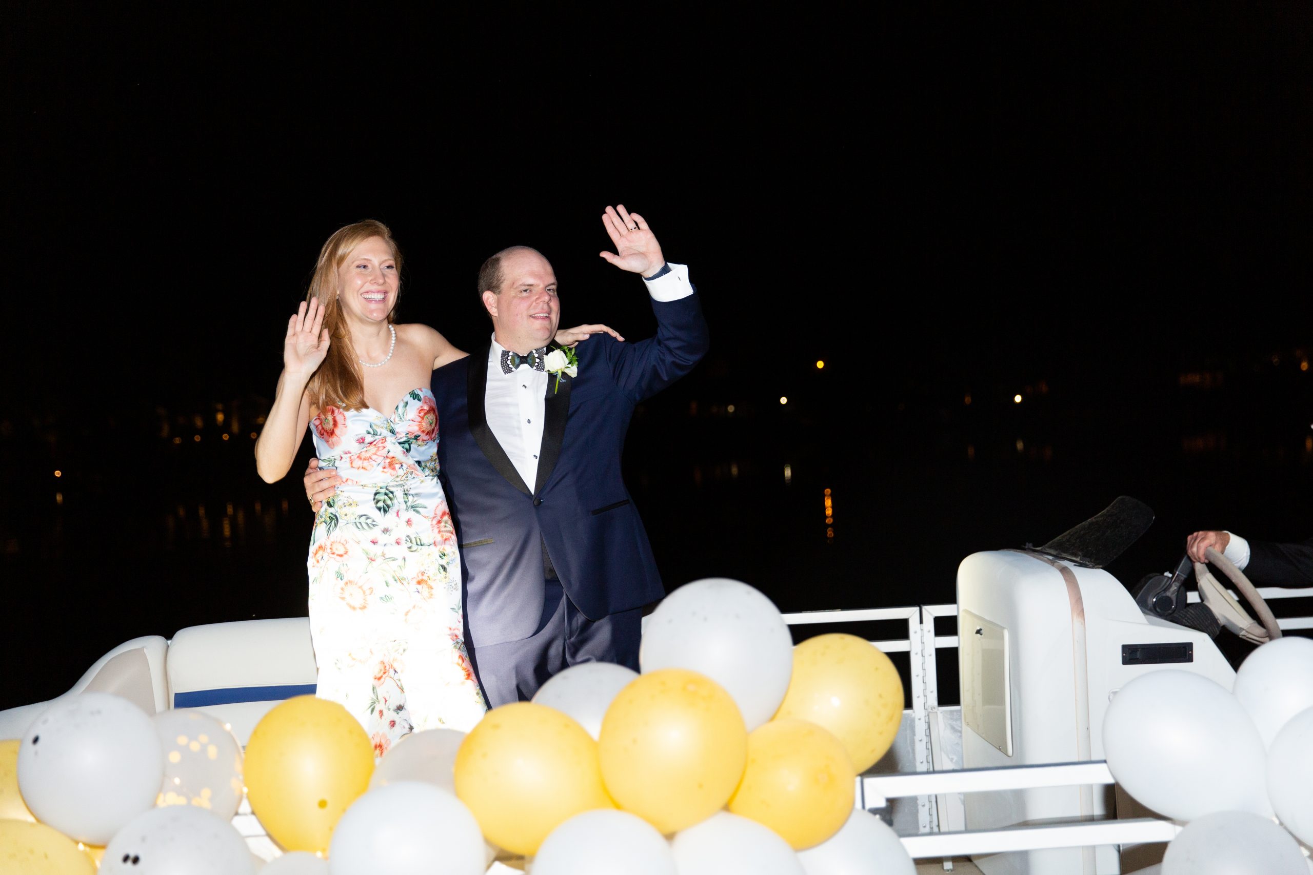 Katherine and William made their way down to their getaway boat, a balloon festooned pontoon that had been decorated by the bride’s cousins. It was piloted by stepfather Fred Crawford and first mate Edward Grimsley, the groom’s nephew.