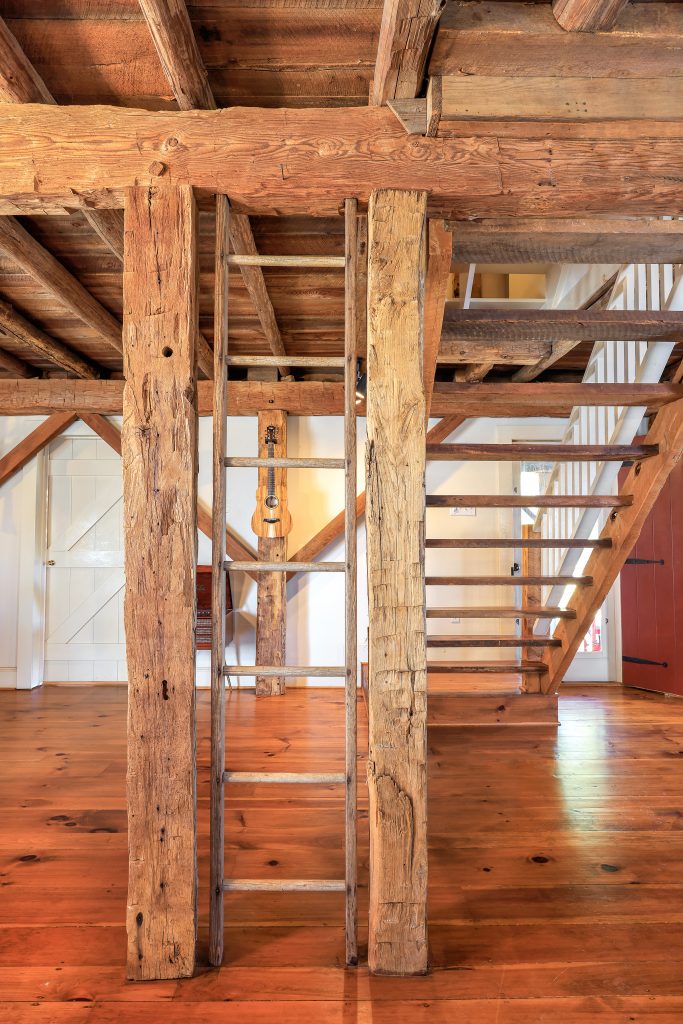 No feature of this home lacks a story. The original ladder leading to the hayloft extends to the ceiling in the center of the living room, and the striking staircase leading to the second and third floors was constructed from cedar trees downed by a tornado. 