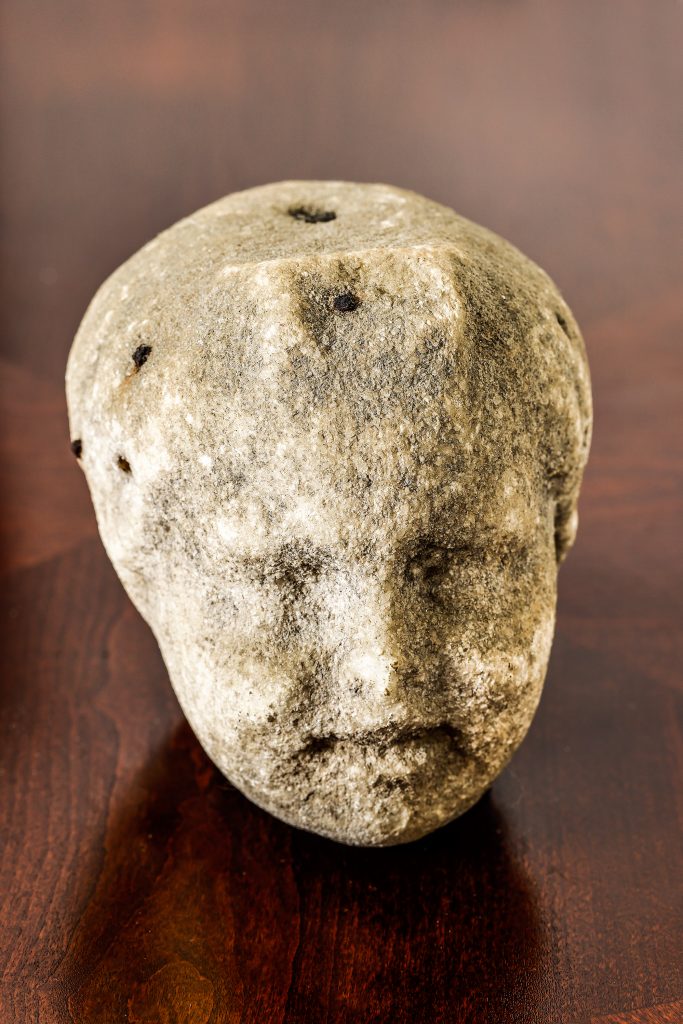 These statue heads are typical of the Romans and were among the artifacts discovered by the Maolis in their field. These ancient Roman garden ornaments were part of larger statues, indicated by the holes in their heads and the flat head of one.