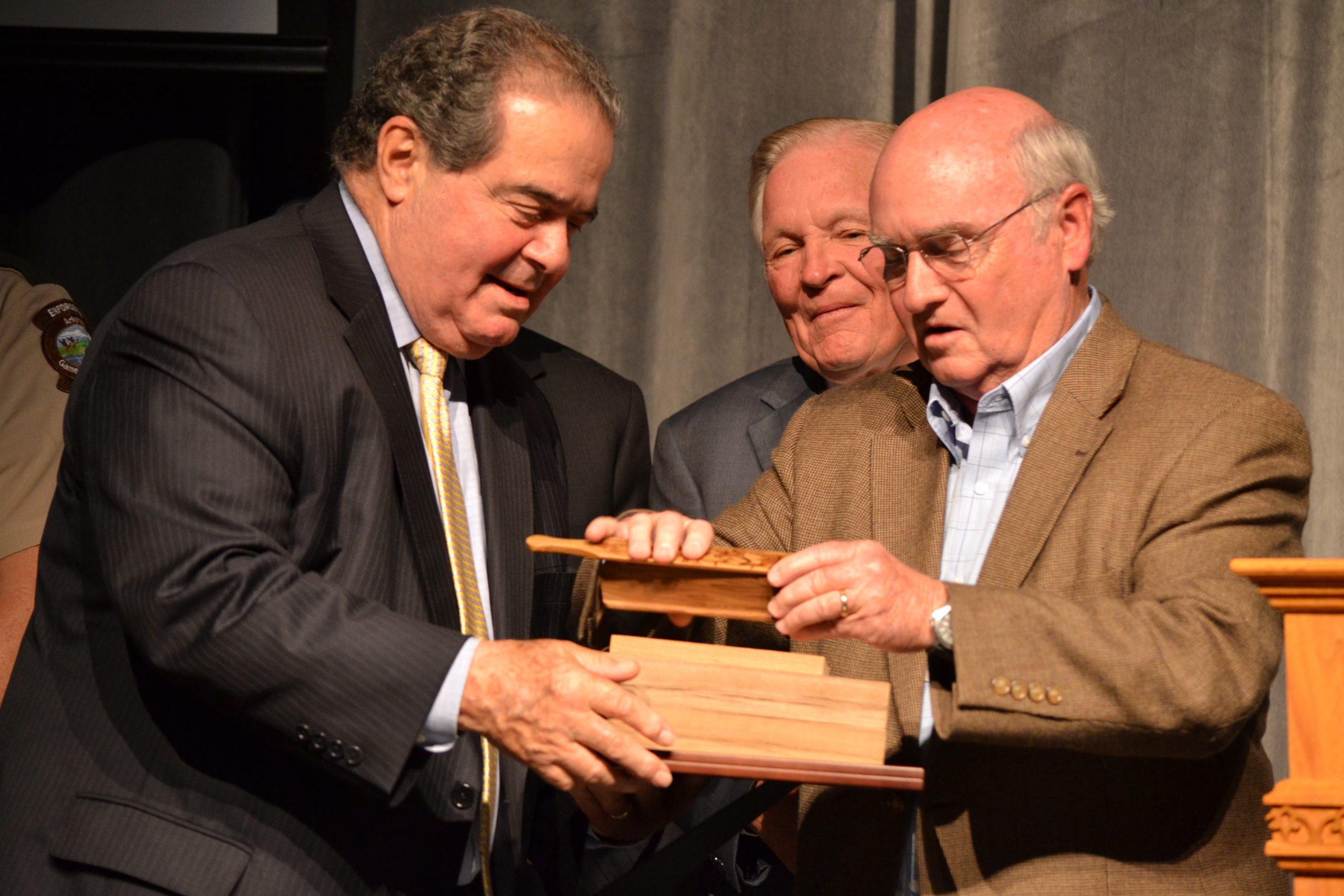 John Tanner presents the special turkey call he made for U.S. Supreme Court Associate Justice Antonin Scalia after his fireside chat, Arkansas State University, Mountain Home.  Photography courtesy of Amanda Herd, ASUMH