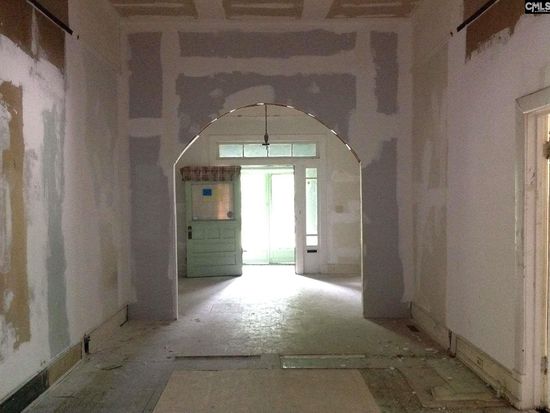 Part of the archway was kept during the renovation between the entryway and the living room.
