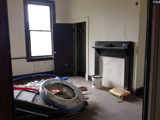 Before the renovation. The cooktop is now where the fireplace was.