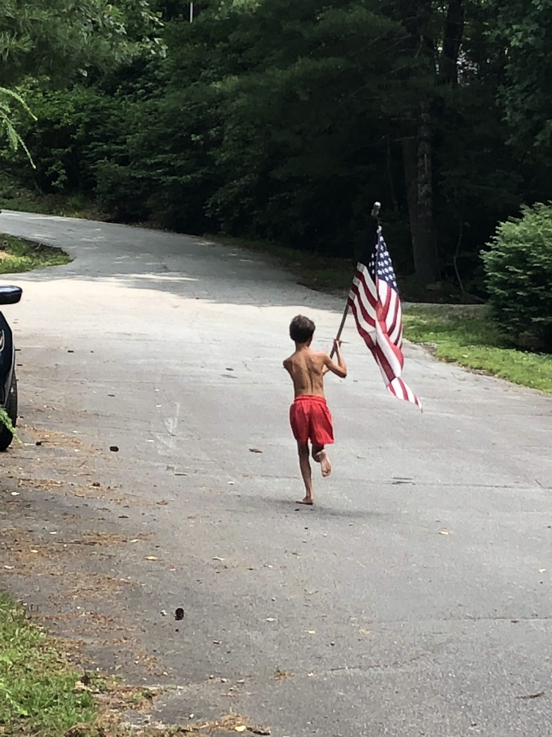 Summer holidays are a big deal at Caesar’s Head, particularly the Fourth of July, which is celebrated with a community-wide barbecue and golf cart parade. James Hicks loves to carry the flag in front of the parade!