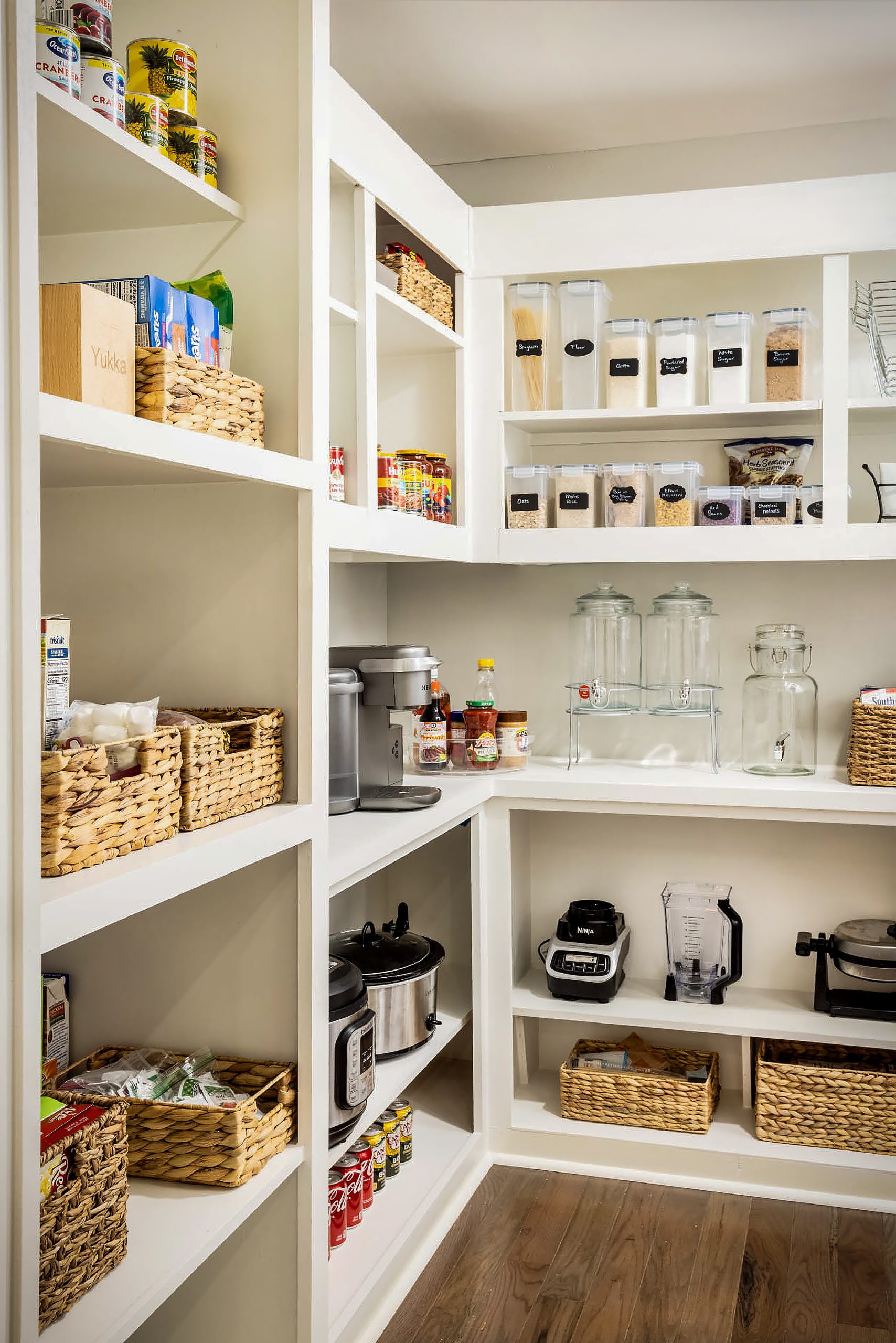 One of the many innovative features of the Giles kitchen is their hidden walk-in pantry. What looks like a standard tall cabinet on the outside is actually a concealed entrance to a separate room off the kitchen. 