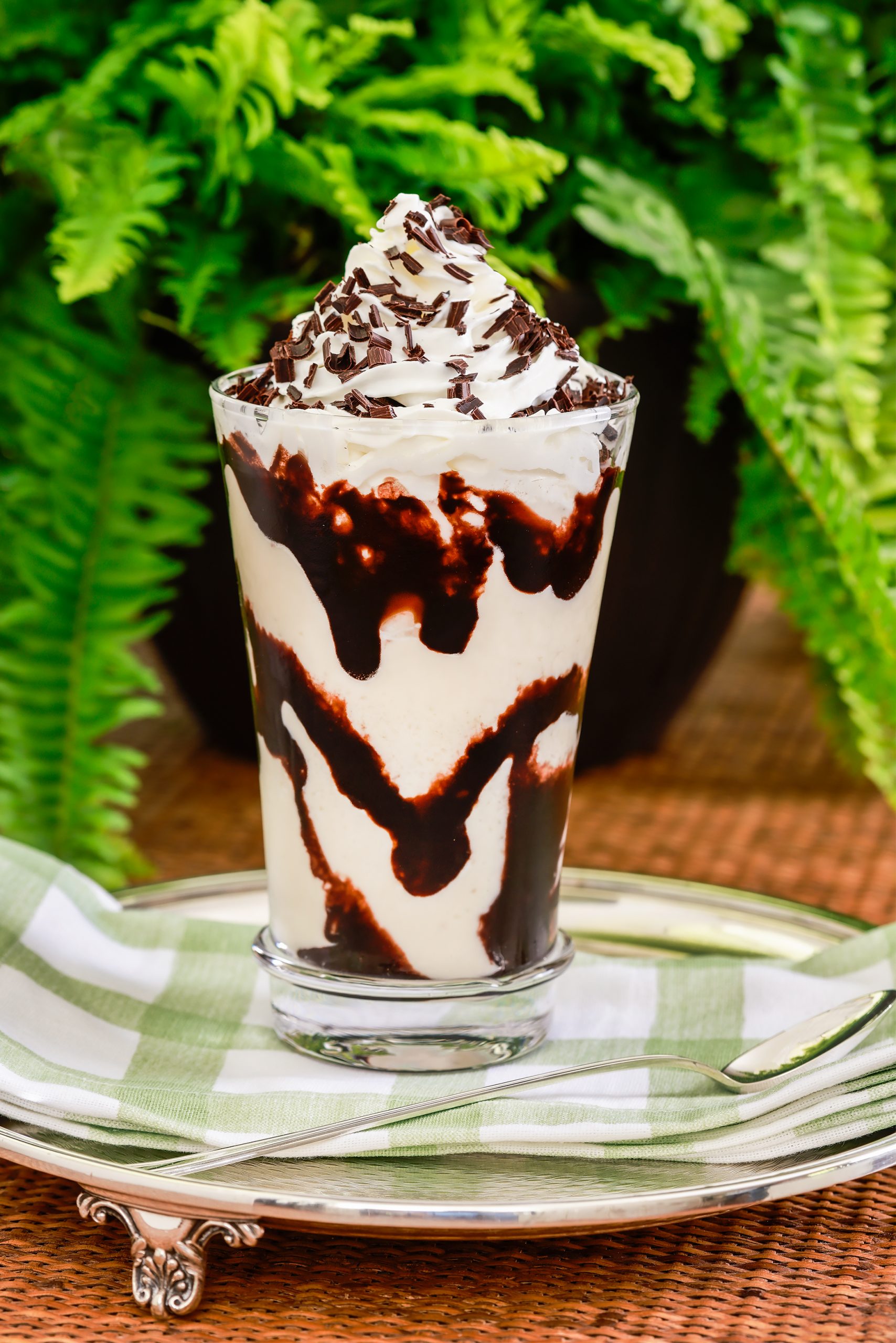 The Congaree River Mudslide with coffee liqueur, vanilla ice cream, and chocolate syrup and shavings is a decadent and delightful dessert. Juliska large tumbler courtesy of Cottage & Vine and Tableau linens courtesy of Kudzu Bakery & Market.
