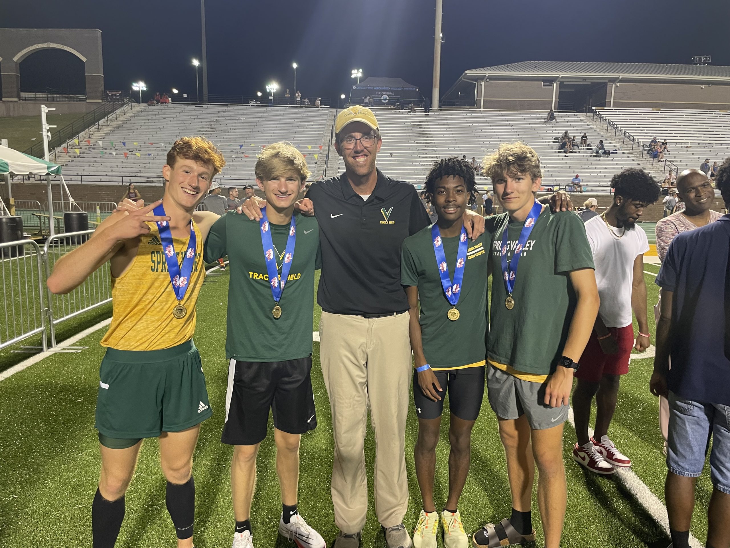 In track and field, Spring Valley boys won the Class 5A overall championship, and Coach Matt Oberly was named state track coach of the year. The 4 x 800m Relay State Championship Team poses with their gold medals: Ethan Taylor, Jack Stacy, Head Coach Matt Oberly, Tyler Shuler, and Jackson Inmon. Photography courtesy of Spring Valley High School