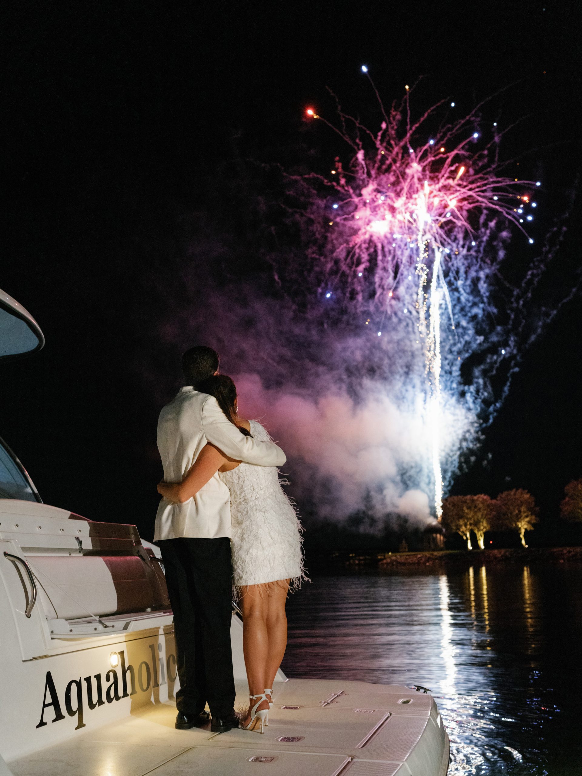 At the end of the evening, Fly Fidelity’s trombone and saxophone players joyously escorted the bride and groom to their point of exit, where they could watch a farewell display by Pennsylvania-based PyroTechnico Fireworks from the waters of Lake Murray.