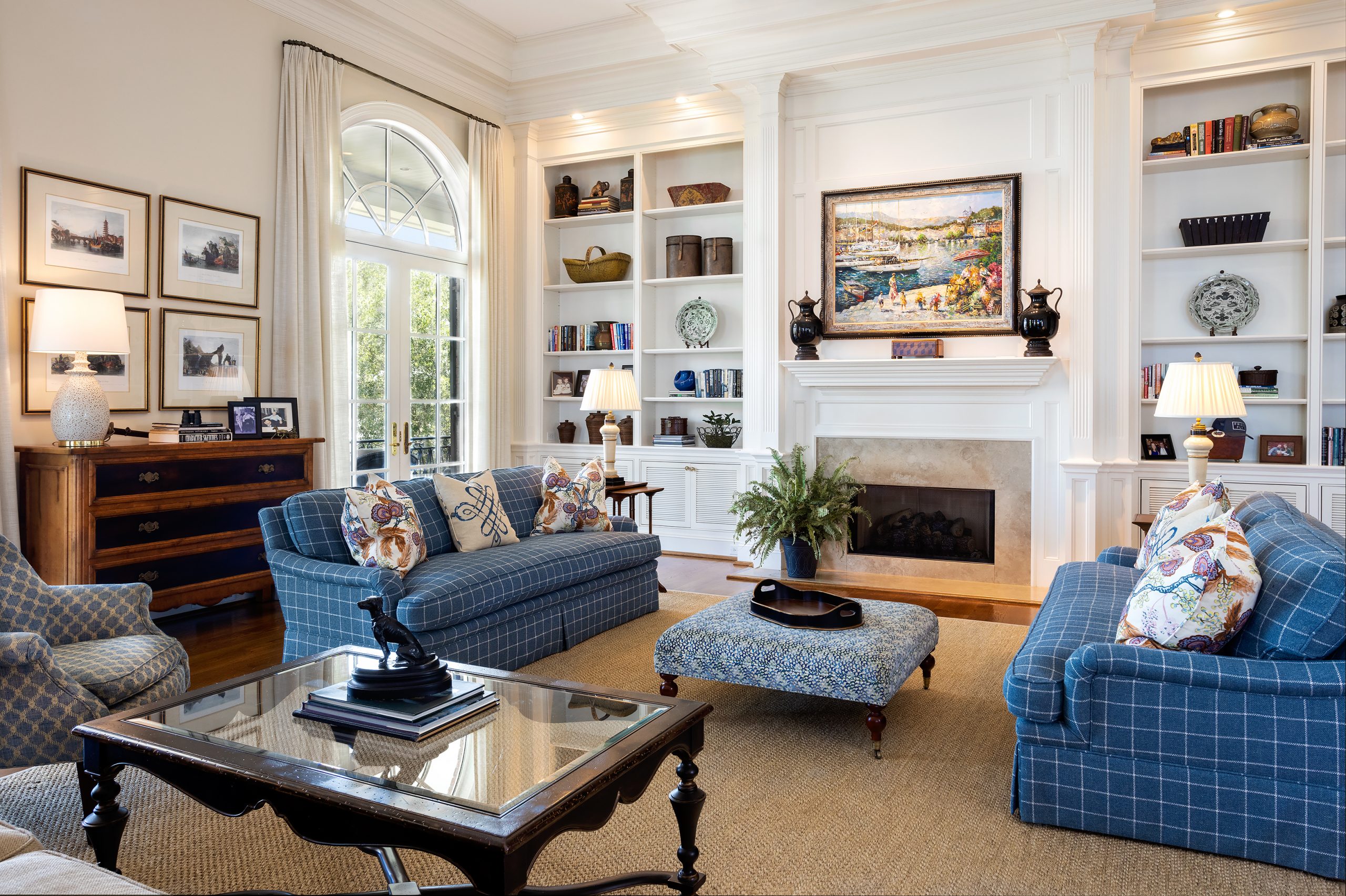 The family room, which shares the kitchen and breakfast area, is the heart of the home with comfortable seating gathered around a fireplace. Everything in the home can be operated by phone or tablets — including managing the lights, alarm, and music, and raising the painting above the fireplace to reveal a hidden television! 