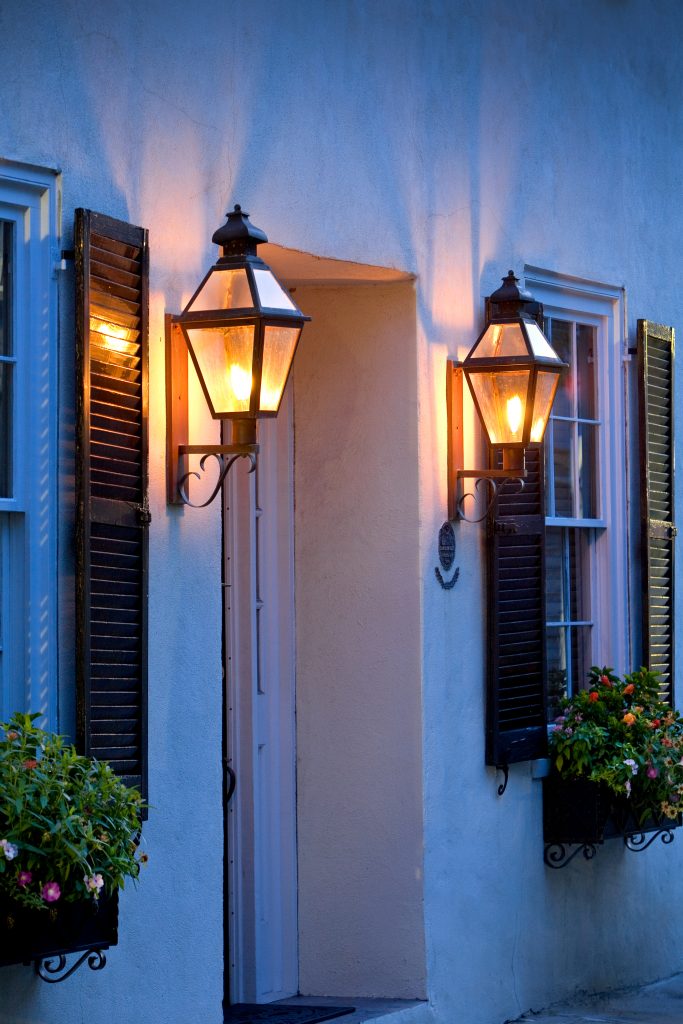Lamps light the way as visitors discover Charleston’s homes and alleys dating back hundreds of years. 