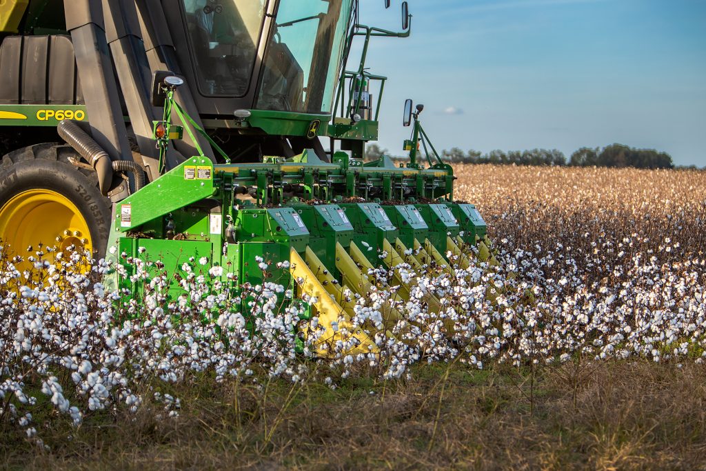 Six Rows — Count the yellow cutting guides on this baler, and you know six rows of cotton will be cut on this pass in the field.
