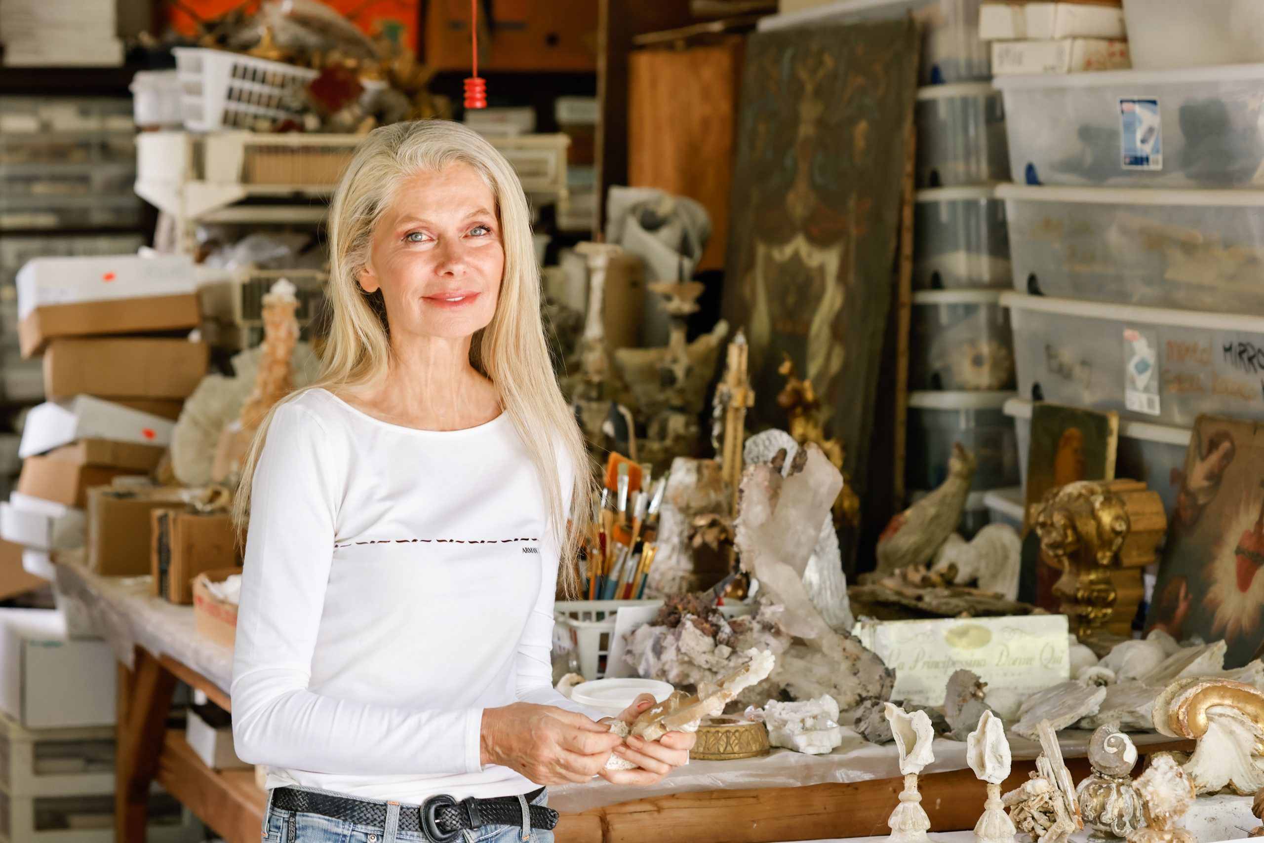 Jean’s studio is her garage; she likes to work outside in natural light. She turns piece after piece over in her hands, pointing out how crystals fill gaps in 300-year-old wood carvings, looking as if nature placed them there. 