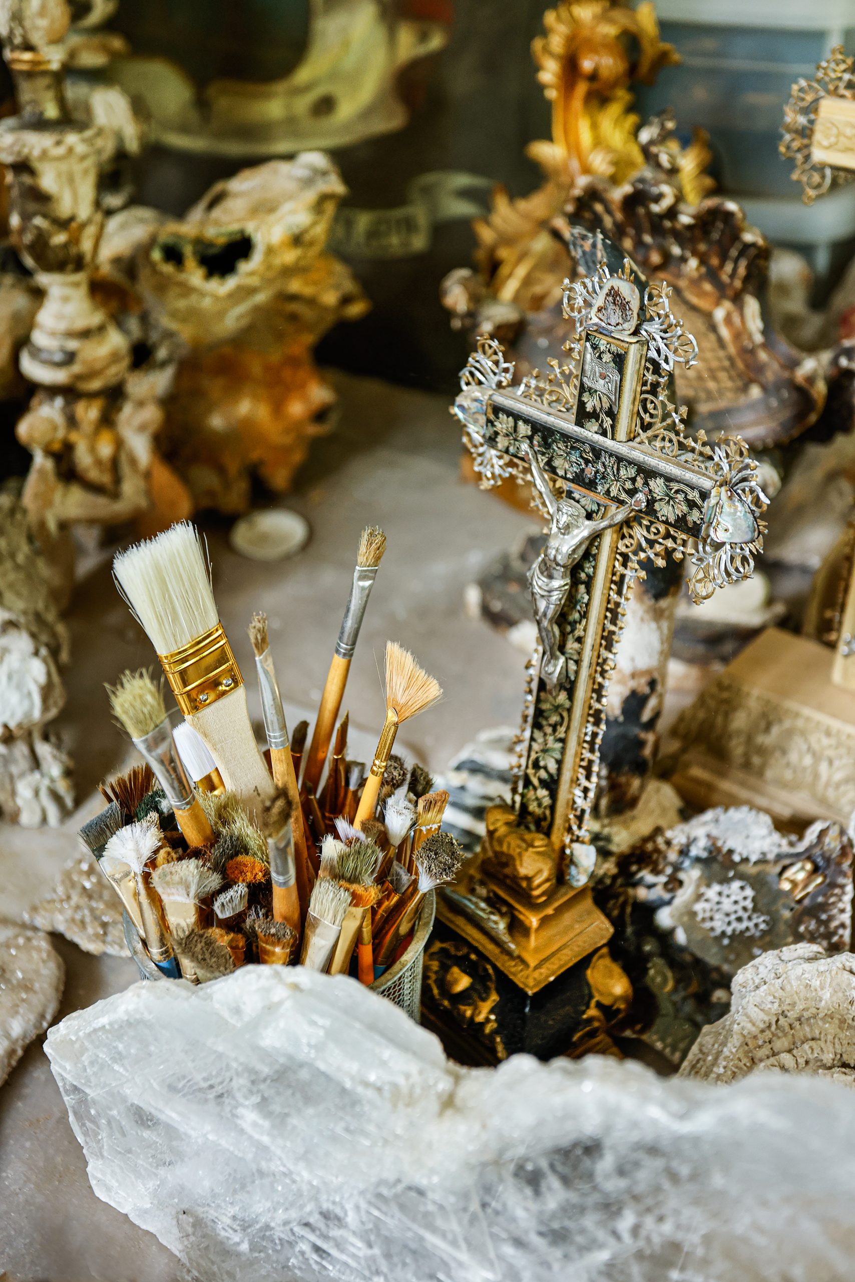 Nineteenth century French crucifix with metal filigree and a silver figure of Christ with abalone shells.