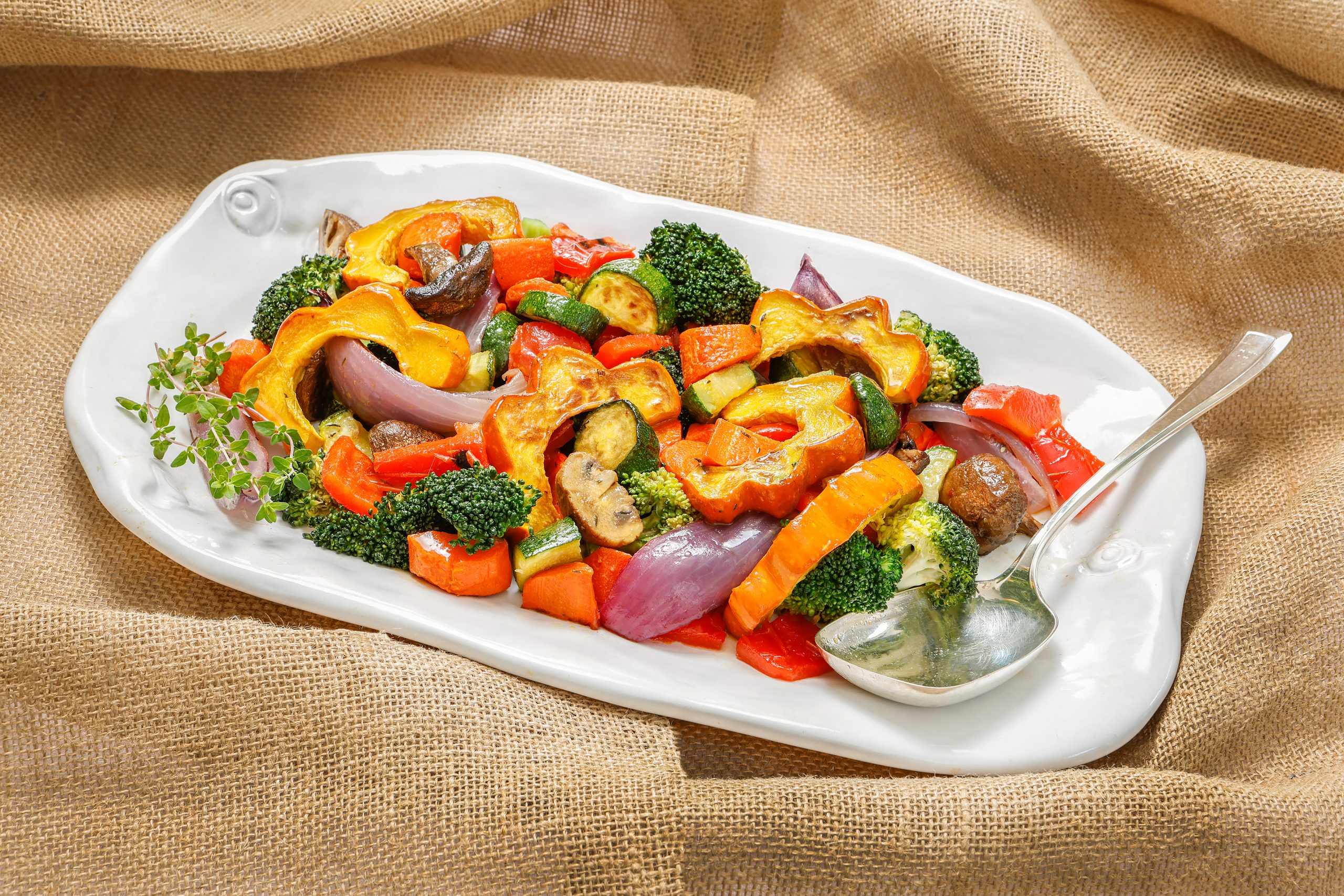 The caramelization that occurs during the roasting process in the Roasted Vegetables recipe intensifies the inherent sweetness of the vegetables and enhances the flavor. Montes Doggett large platter courtesy of Kudzu Bakery & Market.