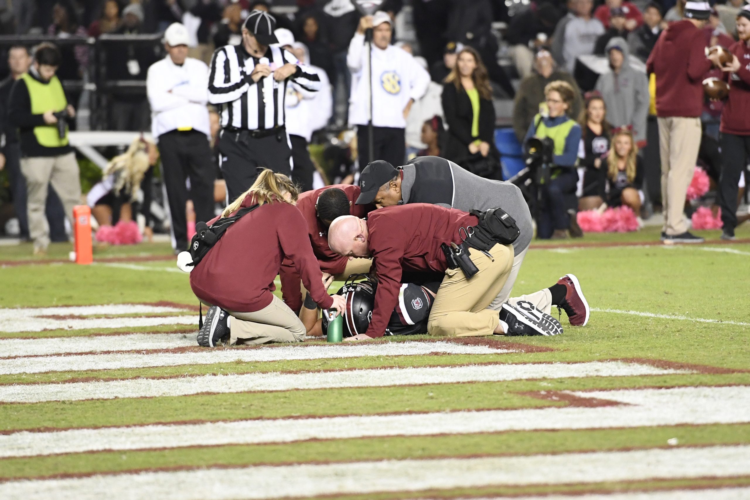 The Gamecocks Athletics medical staff assists an injured player on the field. Clint Haggard, head athletic trainer for the Gamecocks, has been with the football program for 14 years. He leads a group of six athletic trainers assigned to football. It’s the athletic trainers’ job to get the athlete back out on the field as quickly and safely as possible. 