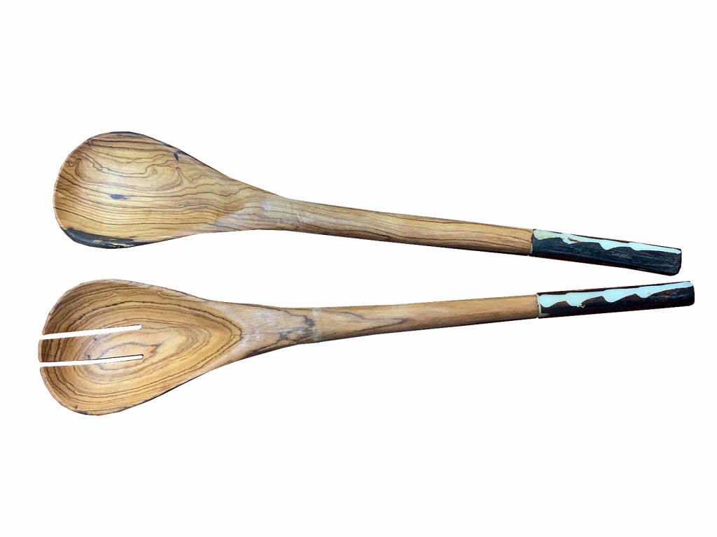 A new item, hand-carved wooden salad spoons  with handles made of cow bone.