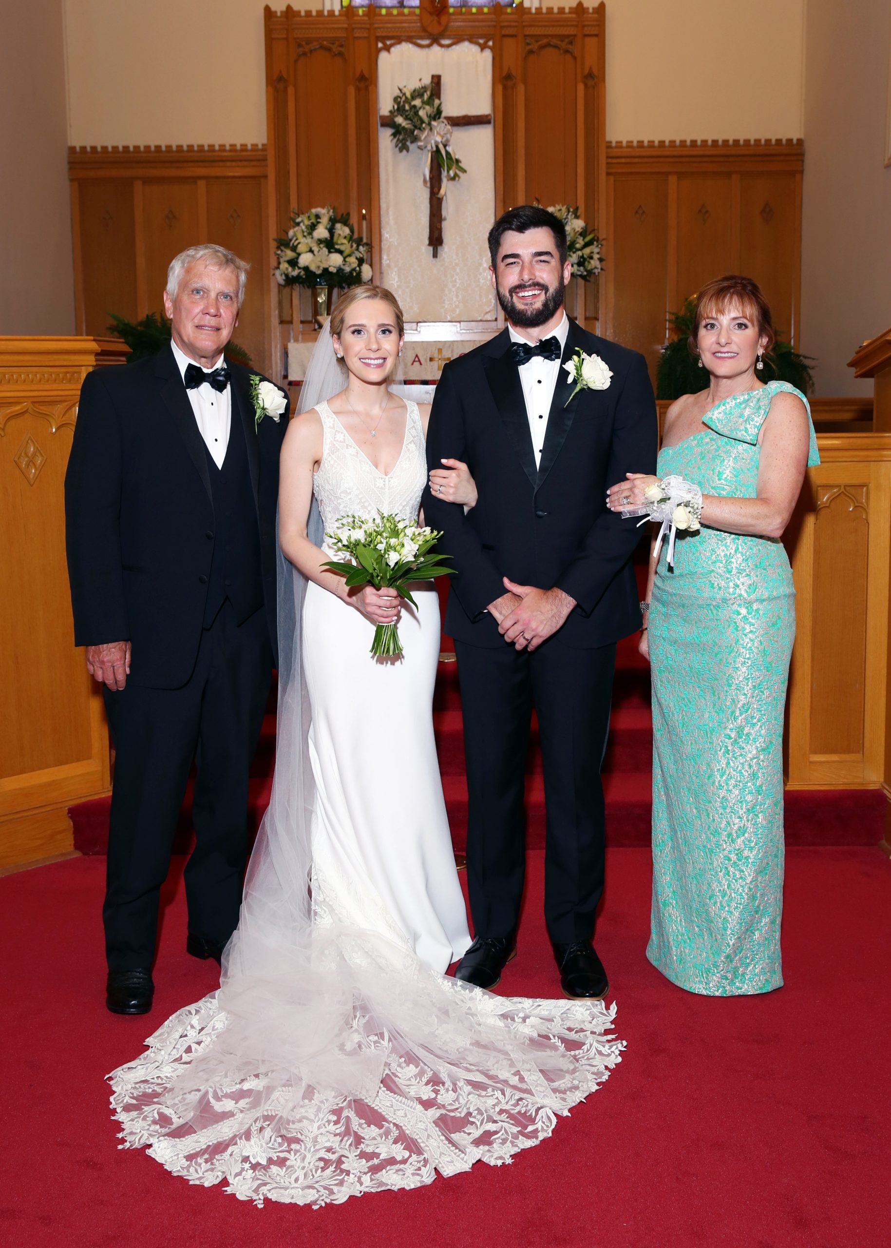 Natalie and Stanton were married at St. Peter’s Lutheran Church in Lexington. The flowers in the church were provided by Lexington Florist, including an arrangement on the altar cross in memory of Judith Parker and Leroy Rabon, Jr., Natalie’s grandparents. Father of the bride Ricky Werner, Natalie and Stanton, and mother of the bride Julie Werner.
