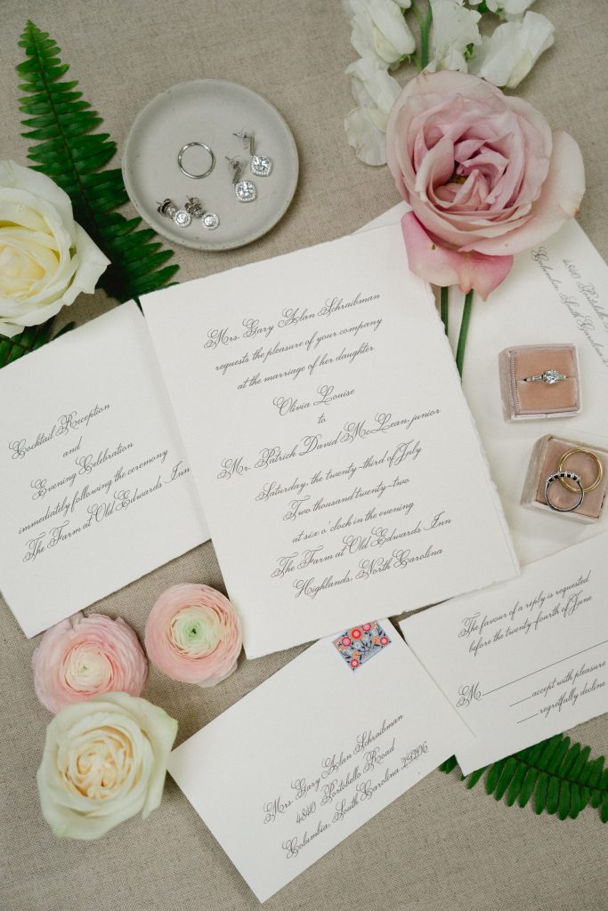 Lou and Olivia chose cream-colored, deckle-edged invitations with the help of stationery and invitation designer Martha Morris. Engraved in a subdued gray script, they were traditional but not staid. 