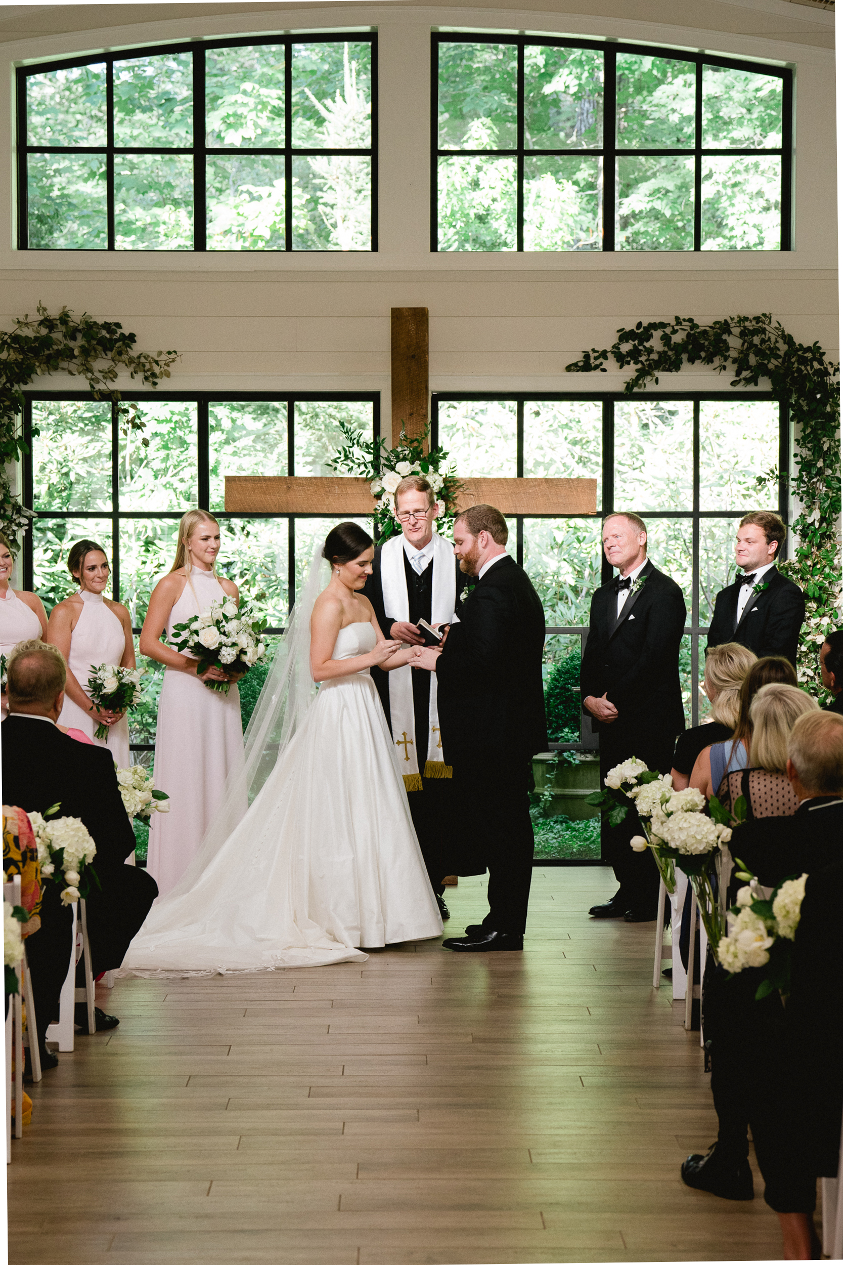After eight years of courtship, Olivia Schraibman and Patrick McLean said their vows at Old Edwards Inn Orchard House, Highlands, N.C. The backdrop was a wooden cross bedecked with white roses and greenery with a wall of windows showcasing the sun-dappled mountain forest. The wedding party included Ari de Lucy, Nan Davenport, Olivia and Patrick, with the Rev. Brad Smith, Patrick McLean (Patrick’s father), and George Schraibman. 