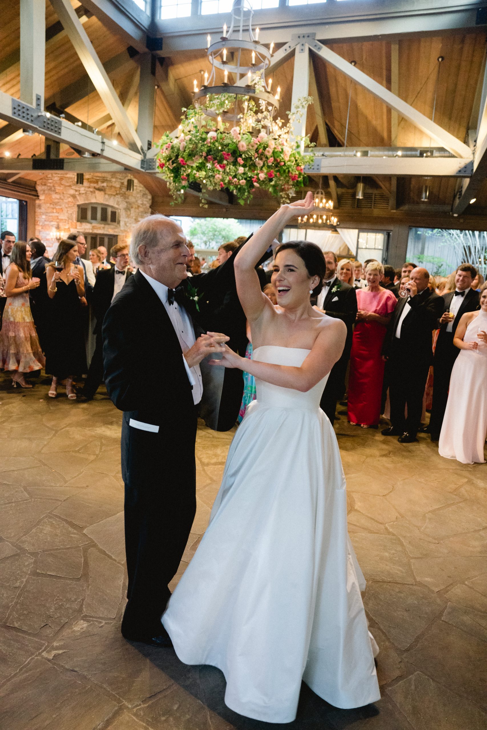 The reception venue was The Farm at Old Edwards Inn. Olivia and her grandfather, Arnold Schraibman, danced to How Sweet It Is by James Taylor.  
