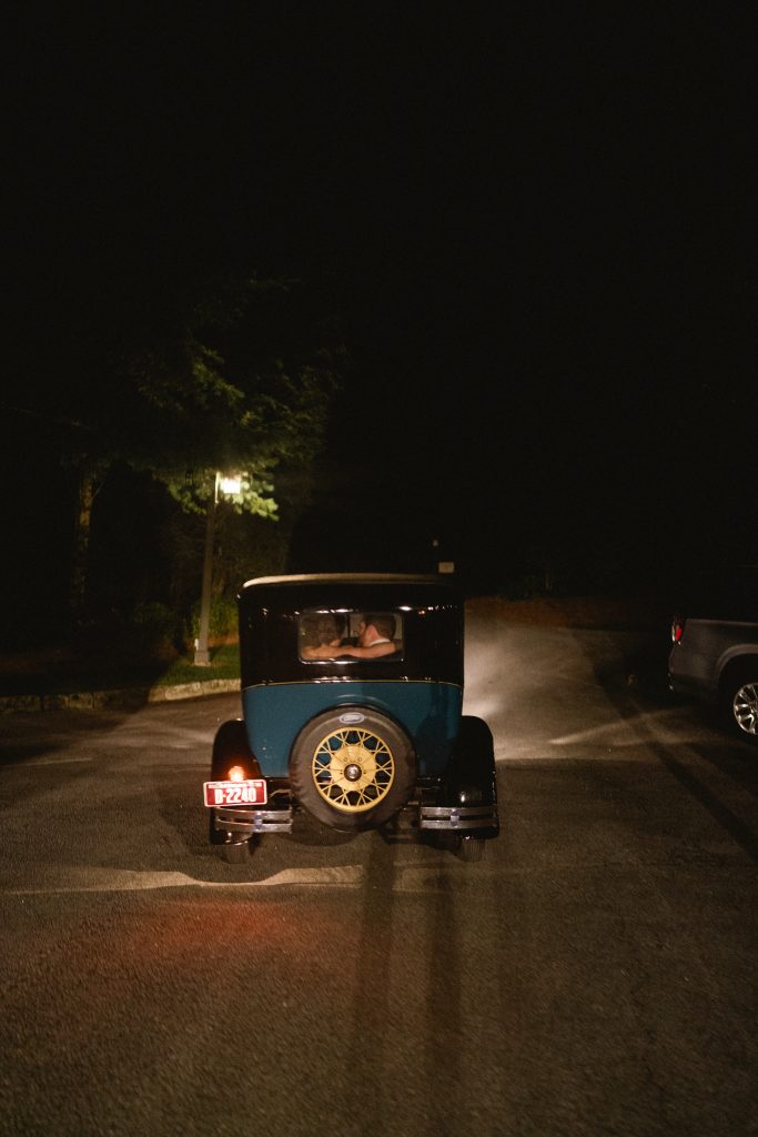 Olivia and Patrick were driven away in jaunty style, aboard an antique Ford Model A.