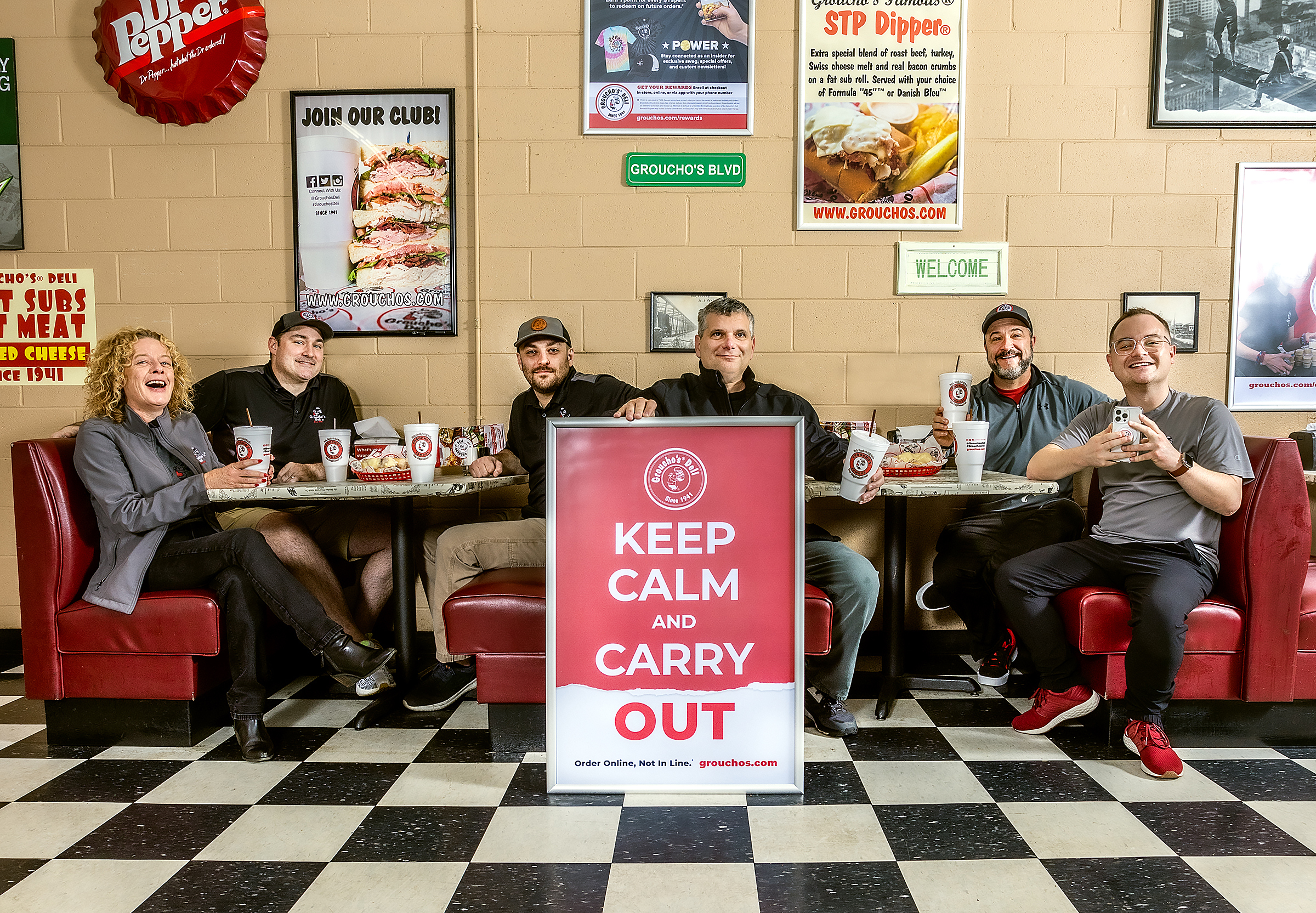How can you “Keep Calm and Carry Out” when Groucho’s Deli is voted Best Sandwich, Best Iced Tea, AND Best Bang for Your Buck? Sit down and dig in! Adrienne Somers, Cullen Padgett, Alex Buchanan, Bruce Miller, Deric Rosenbaum, and Forrest Nettles.
