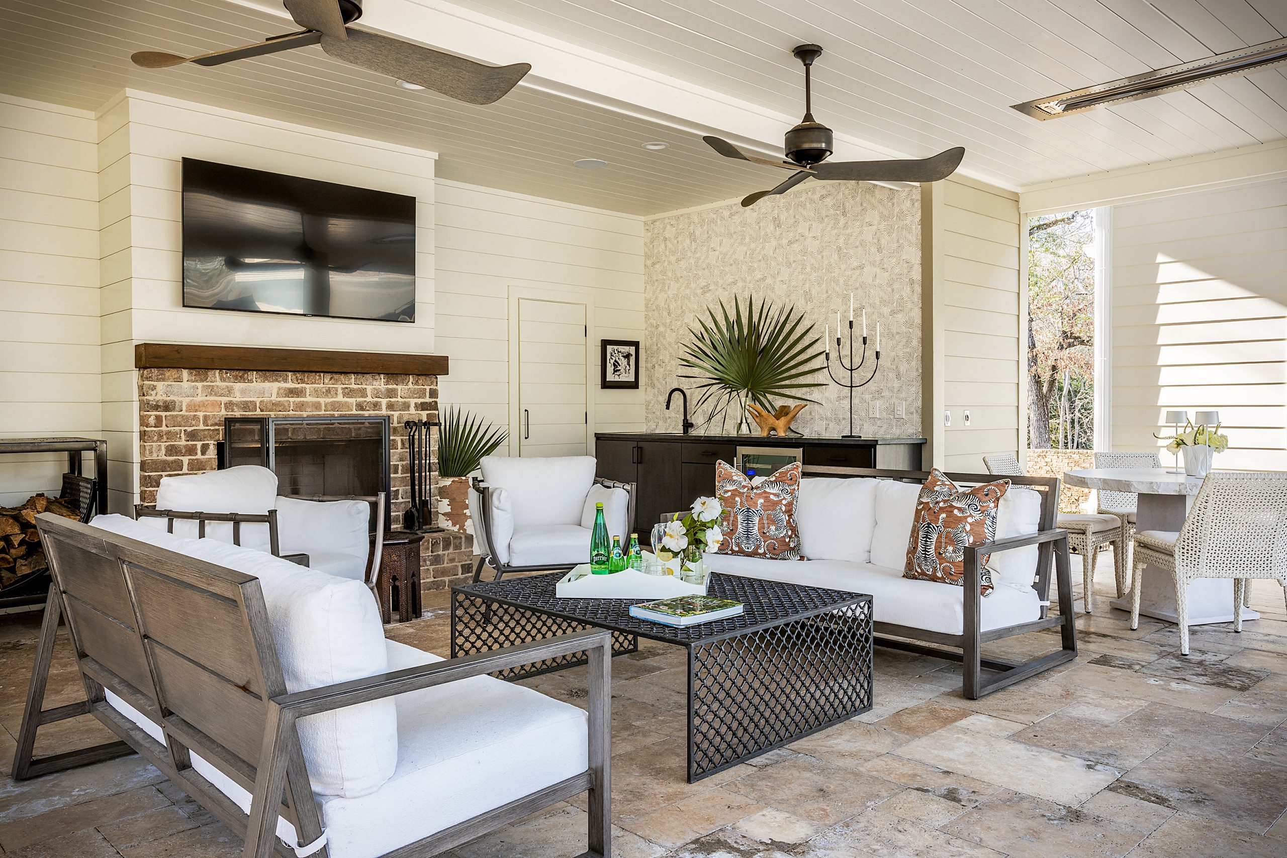  The pool house is an inviting addition that has a comfortable seating area, fireplace, dining area, grilling features, and a large television. More sleeping options are upstairs for their six children and the constant flow of friends! 