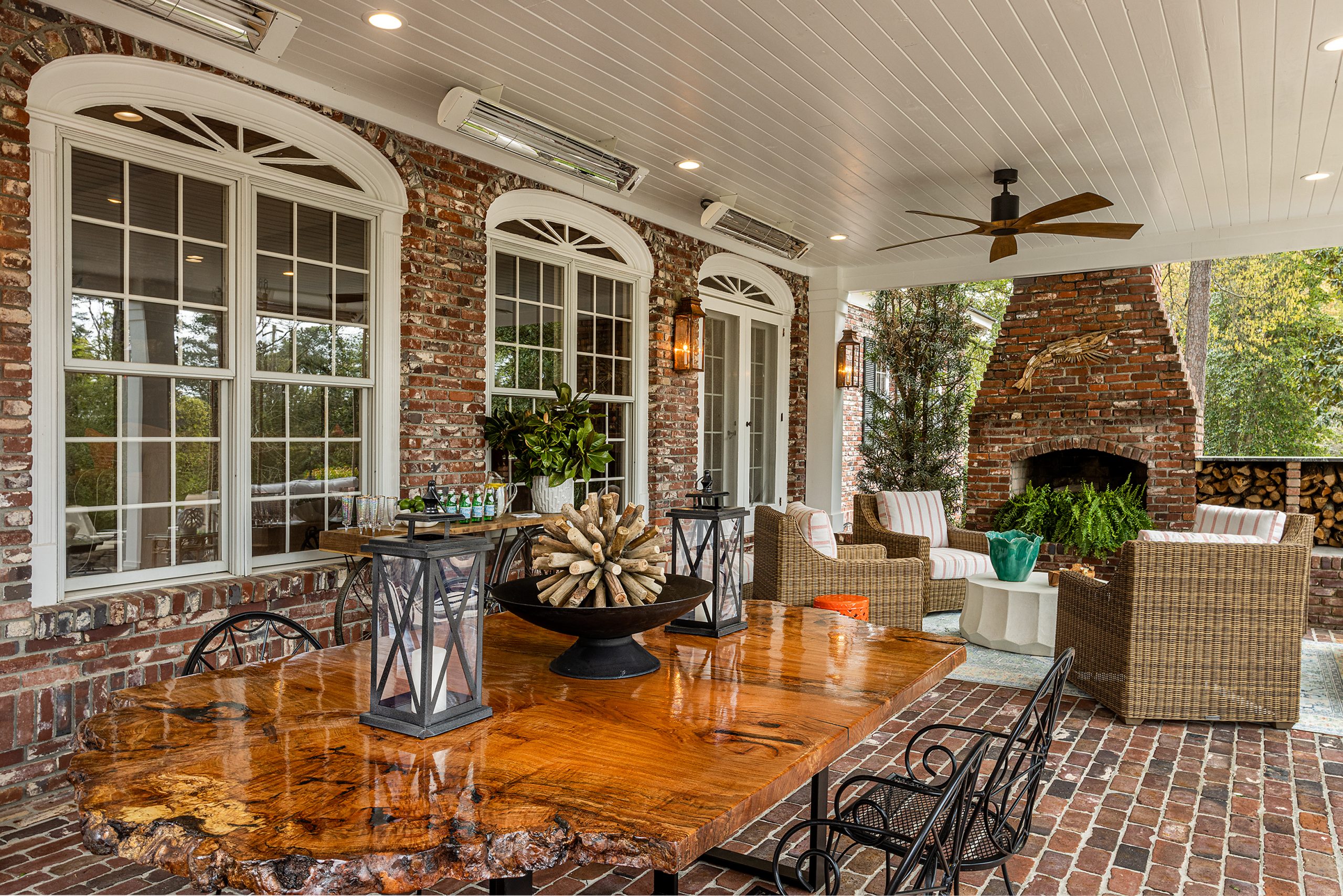 Their most extensive renovation to date is an expansive covered patio through the den’s French doors. Designed around their desire for a Charleston-style swing and a permanent place for Gus to grill, it is perfect for entertaining family and guests. The most striking feature is a massive 109-inch table made by David Zettel, constructed from an old water oak from the grounds of the Governor’s Mansion. 