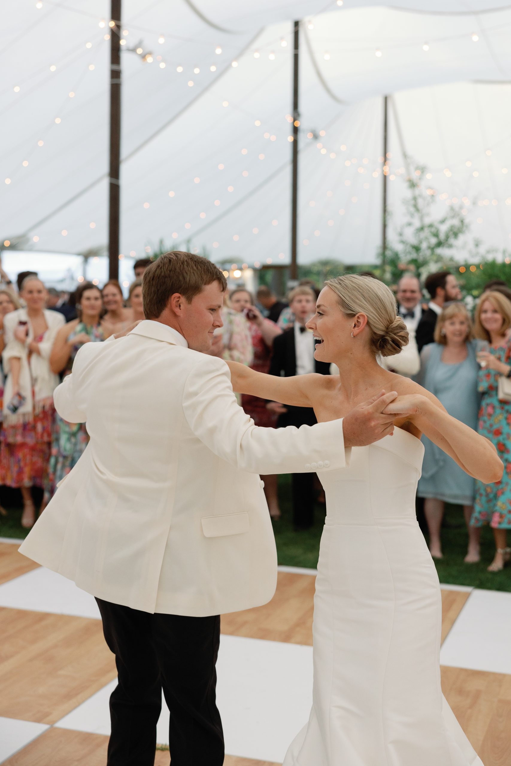 Catered by Southern Way Catering, the reception had a large perfectly sodded tent that included a white and wood patterned dance floor and raised stage for the band. Blake and Bennett’s first dance was to Signed, Sealed, Delivered (I’m Yours) by Stevie Wonder. 