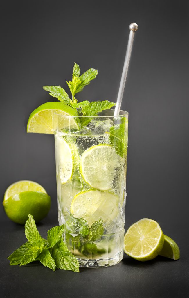 This wildly popular lime-based cocktail comes from a 16th century medicinal Cuban drink used to cure a number of tropical illnesses. While it was originally made from moonshine, aptly named “burning water,” the moonshine was replaced by rum in 1940 with magical results. Indeed, the name comes from the word “mojo,” which means magic charm. Create your own Magical Minty Mojito with the recipe on page 147. Juliska tall highboy, ice bucket and muddler courtesy of Cottage & Vine. Viski gold cocktail shaker courtesy of Kudzu Bakery & Market.
