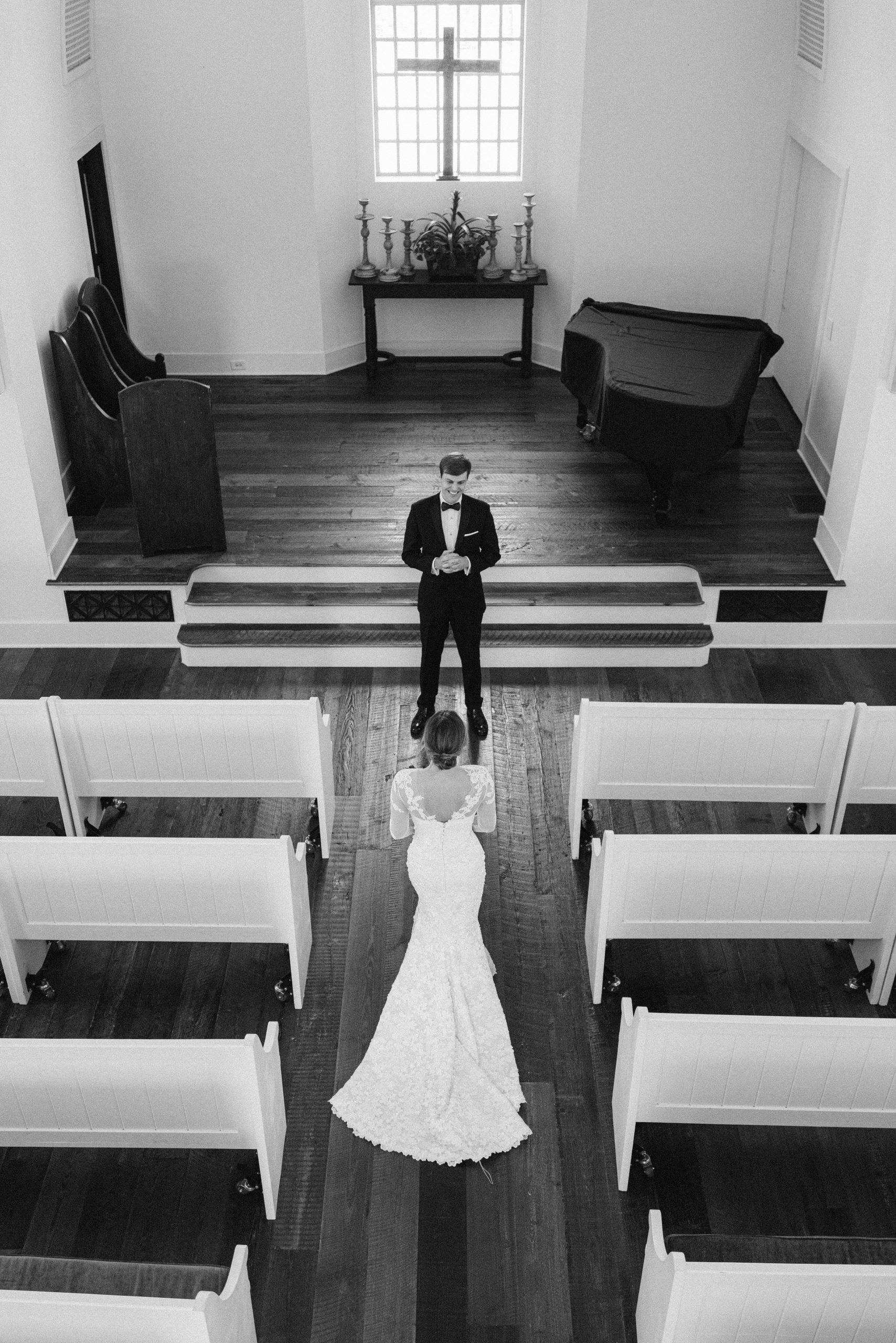 Sutton and Robert’s “first look” was in the Reserve Chapel, Lake Keowee. Sutton’s strapless Sareh Nouri dress from Ladies of Lineage in Charlotte was perfection, with a Sassi Holford lace bolero worn during the wedding ceremony. 
