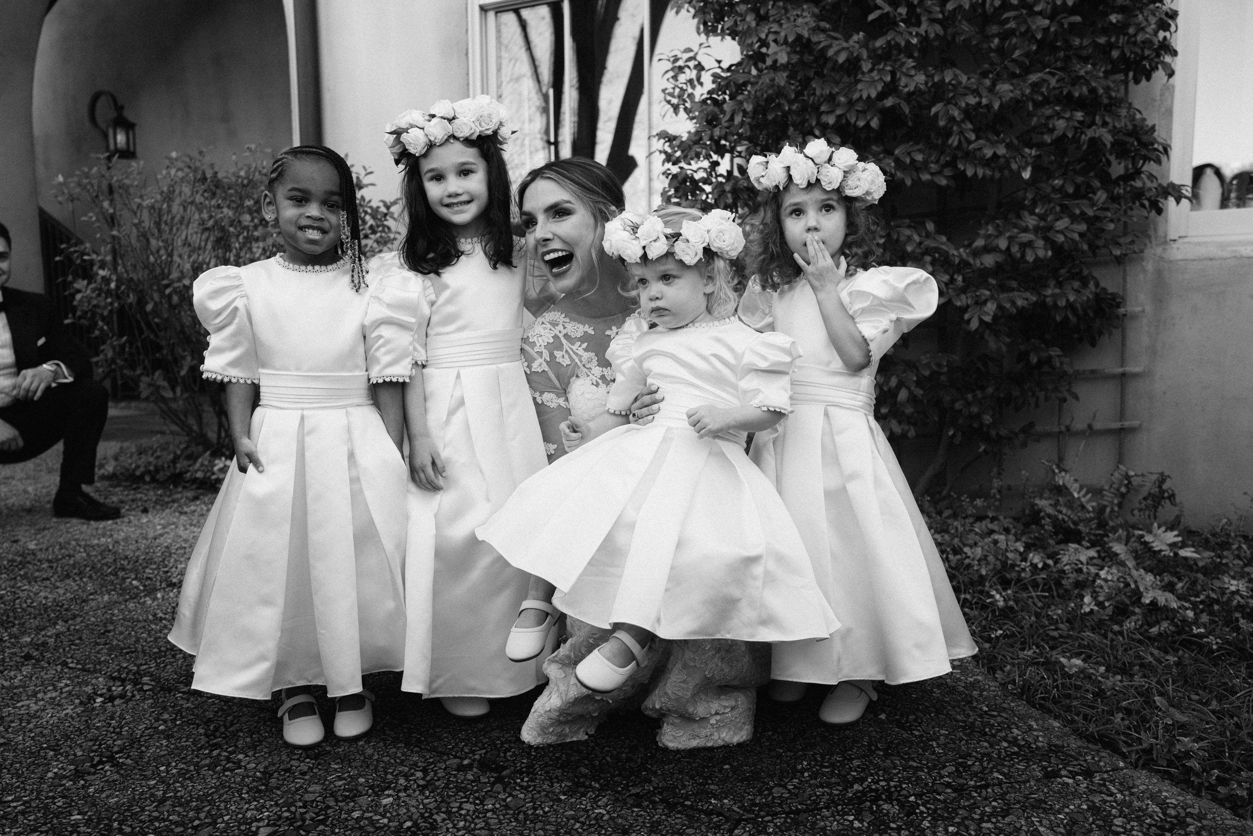 Sutton’s bridesmaids were followed by a sweet group of white-frocked flower girls: Willow Noblitt, Abigail Bynum, Eliza Bynum, and Naomi Noblitt. 