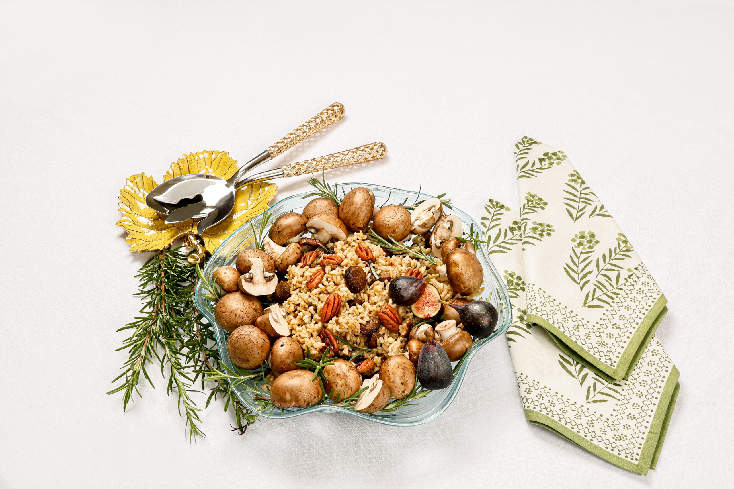 Whole grain rice and roasted baby bella mushrooms offer a meal rich in antioxidants, vitamins, and minerals that boost the immune system. Gold hollow braid serving set and vine grape leaf yellow dish courtesy of non(e)such. 